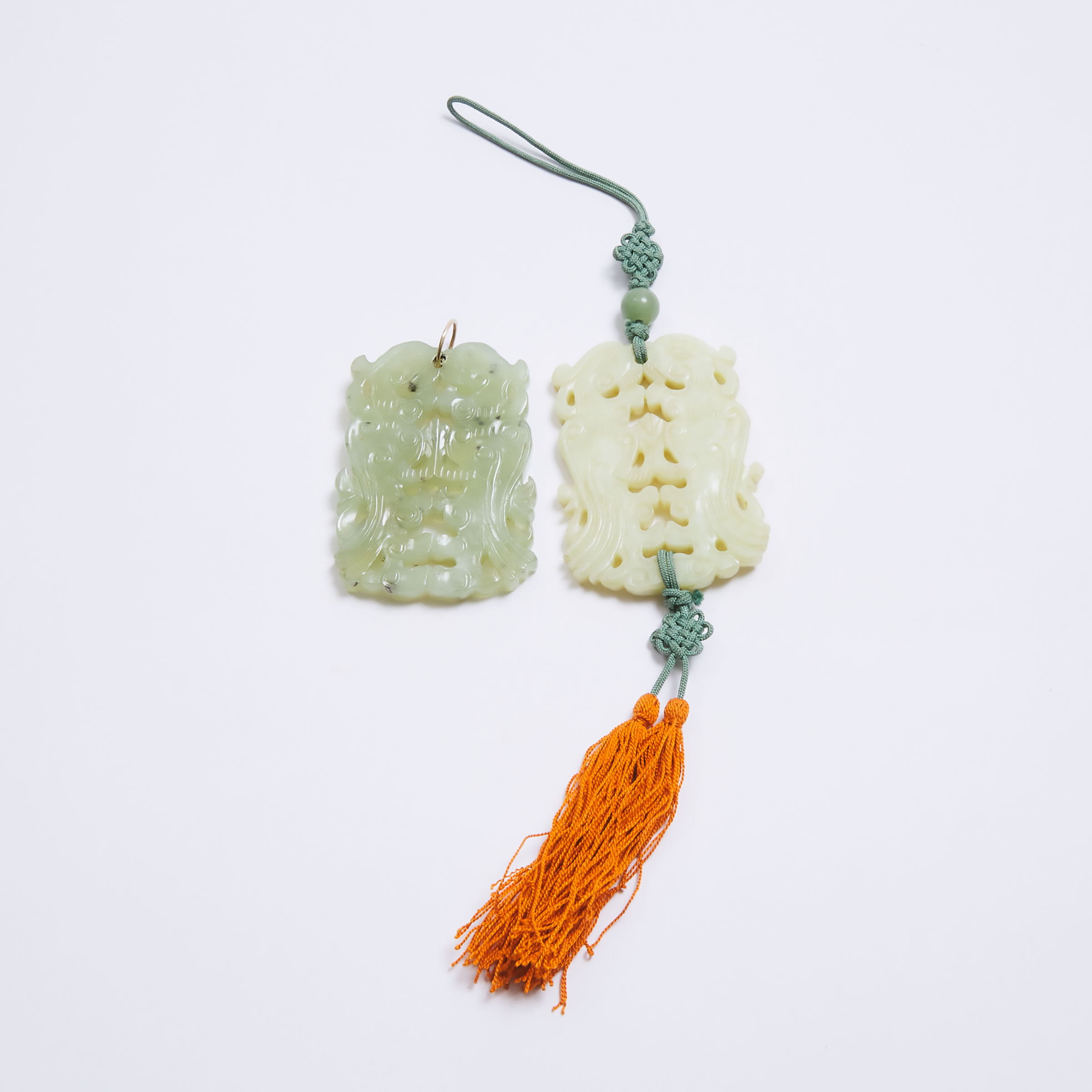 Two Reticulated Jade 'Double Phoenix' Pendants, Early to Mid 20th Century