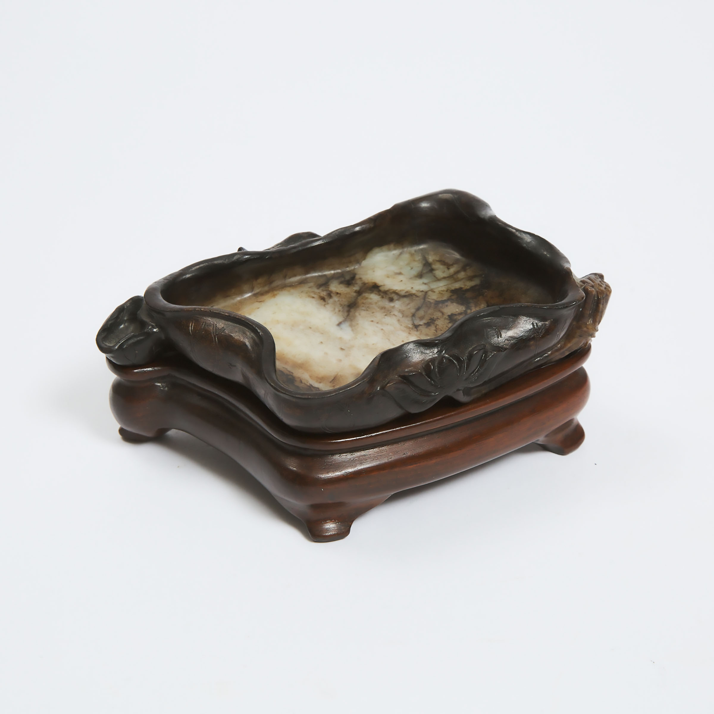A Black, Beige and Russet Jade 'Lotus' Brush Washer, Ming Dynasty