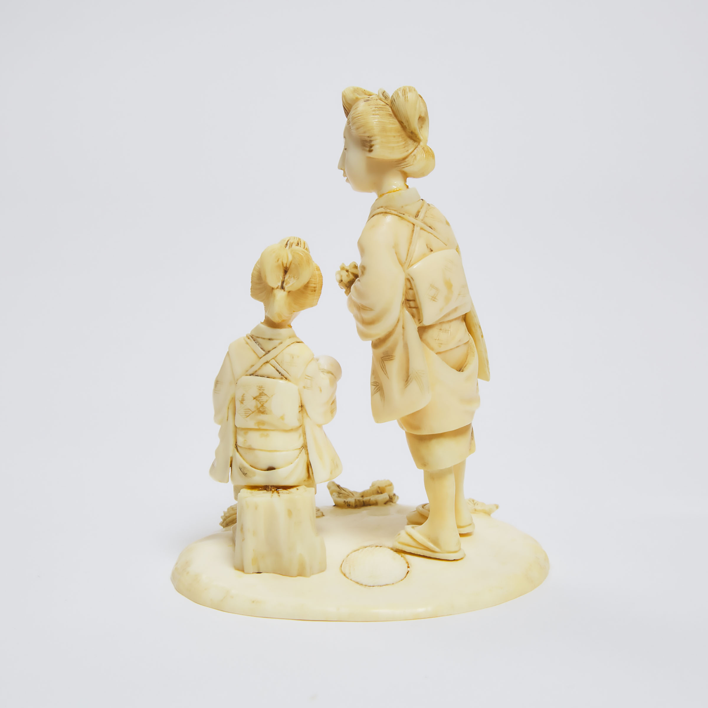 A Japanese Ivory Okimono of A Mother and Child at a Lotus Pond, Signed, Meiji Period 