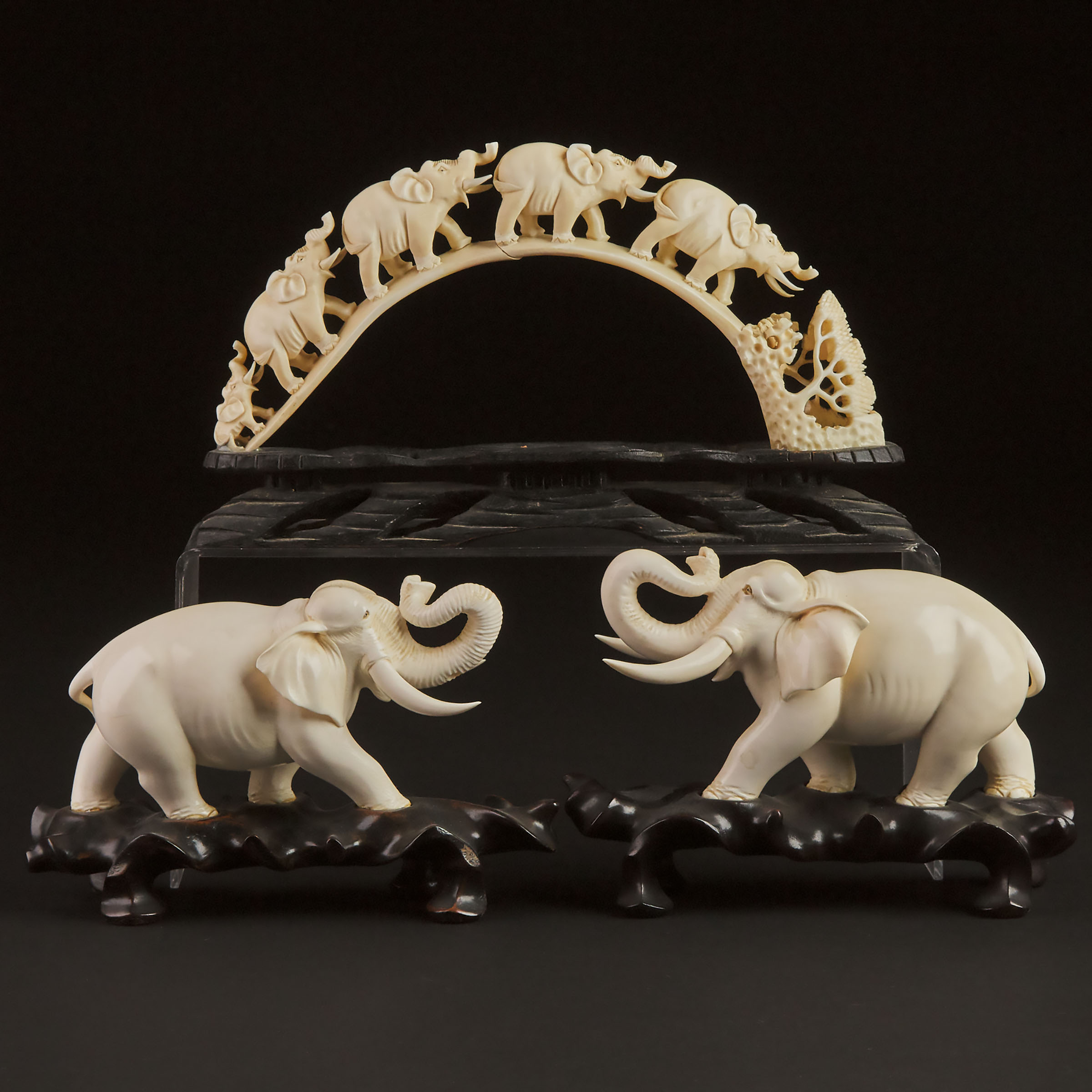 A Pair of Ivory Figures of Elephants, Together With a Tusk-Form Procession, Early to Mid 20th Century