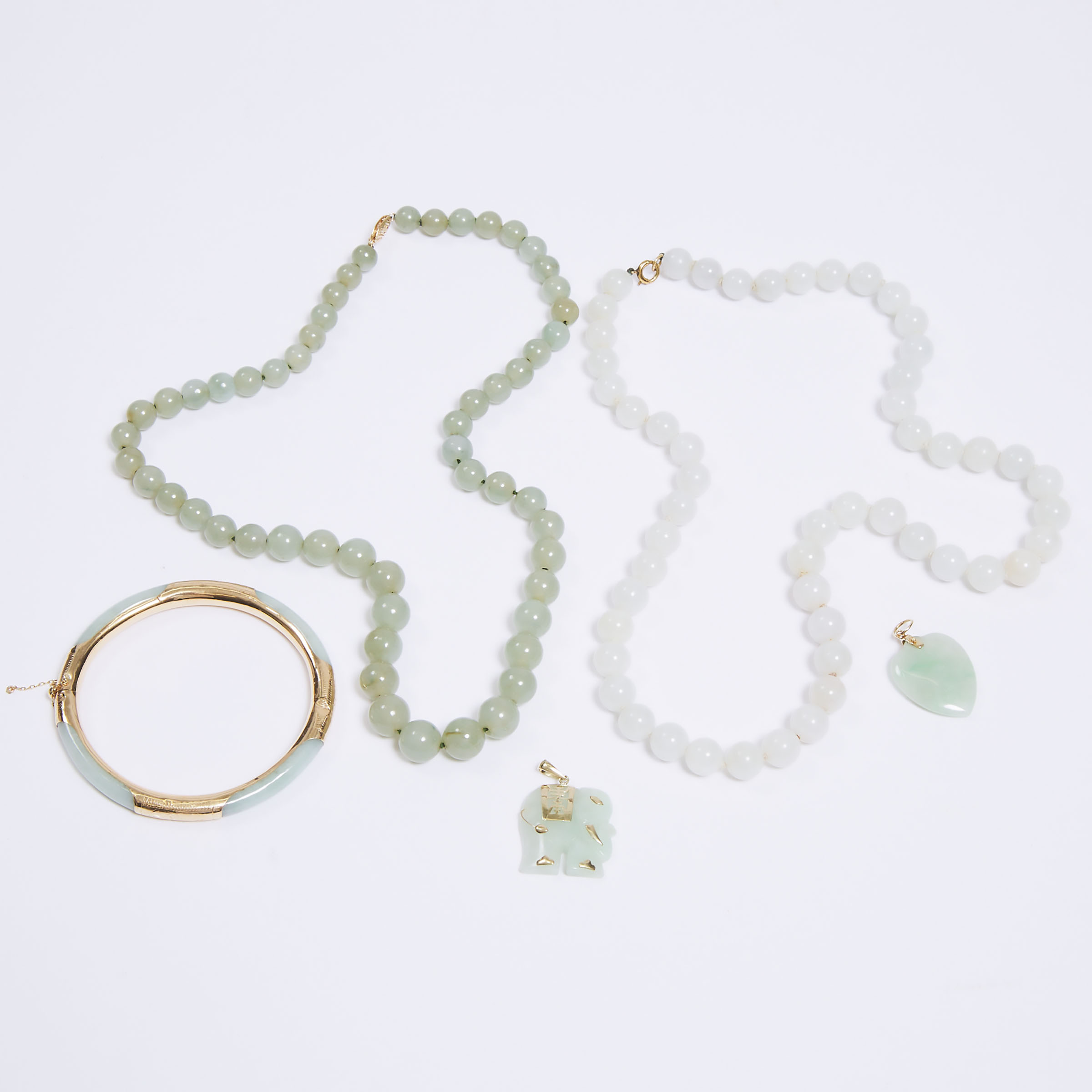 A Group of Five Chinese Gold Mounted Jadeite Jewellery Pieces