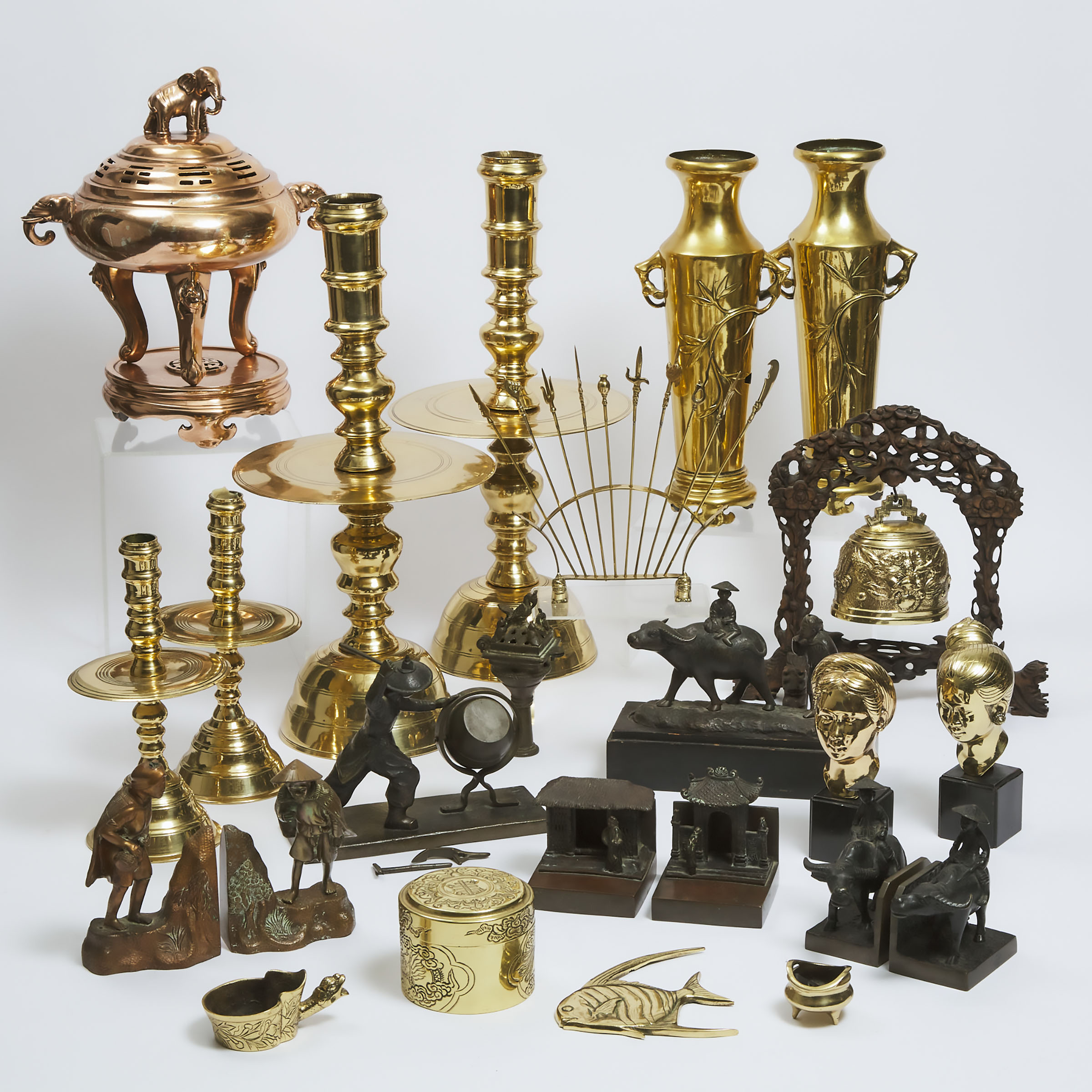 A Large Group of Twenty-Four Vietnamese Bronze and Brass Figures and Wares, Late 19th/20th Century