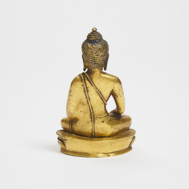 A Tibetan Gilt Bronze Figure of Medicine Buddha, 16th Century