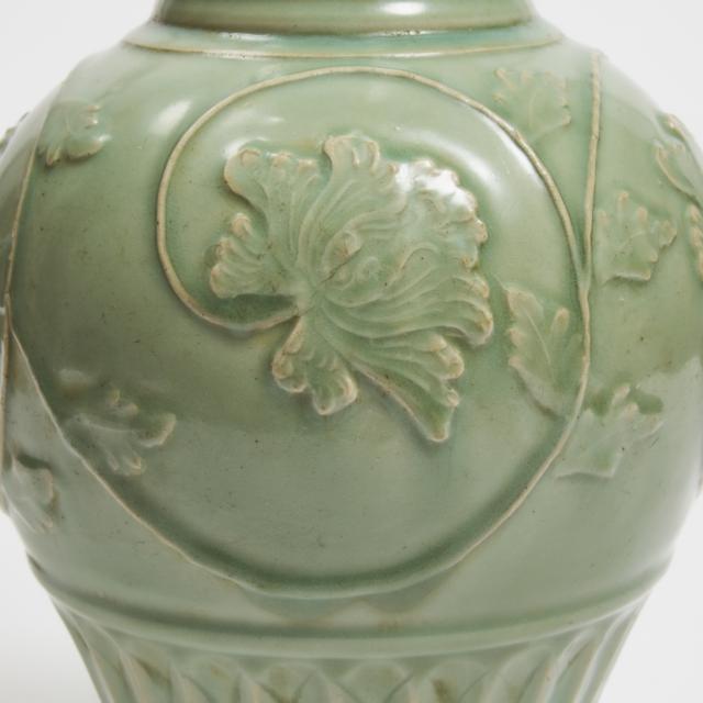 A Large Carved and Moulded Longquan Celadon 'Phoenix-Tail' Temple Vase, Yuan Dynasty, 14th Century