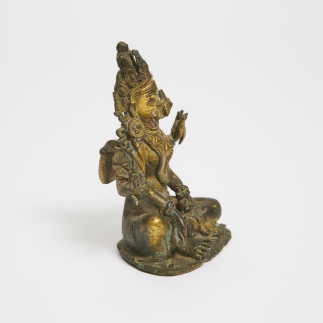 A Nepalese/Tibetan Gilt Bronze Figure of Vasudhara, 18th Century