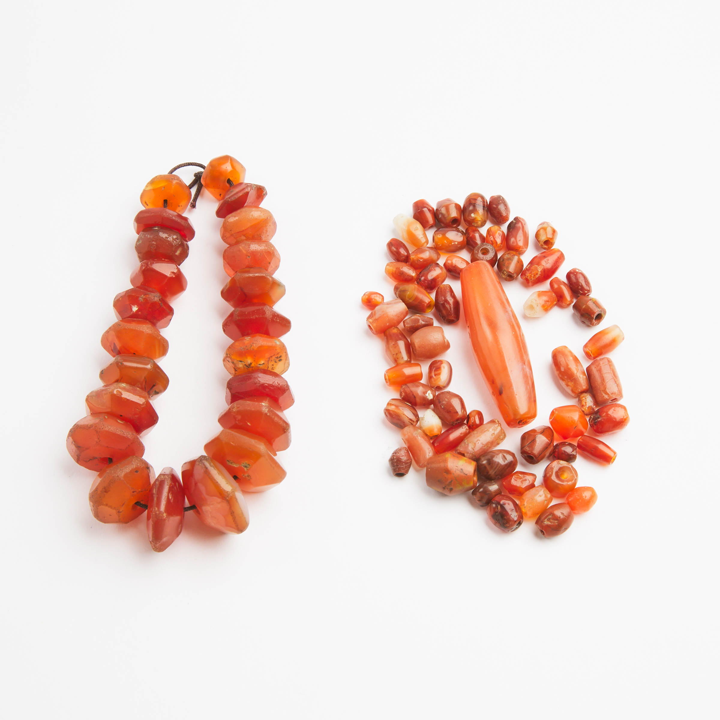 A Western Asiatic Carnelian Beaded Bracelet, Together With Fifty-Nine Loose Beads