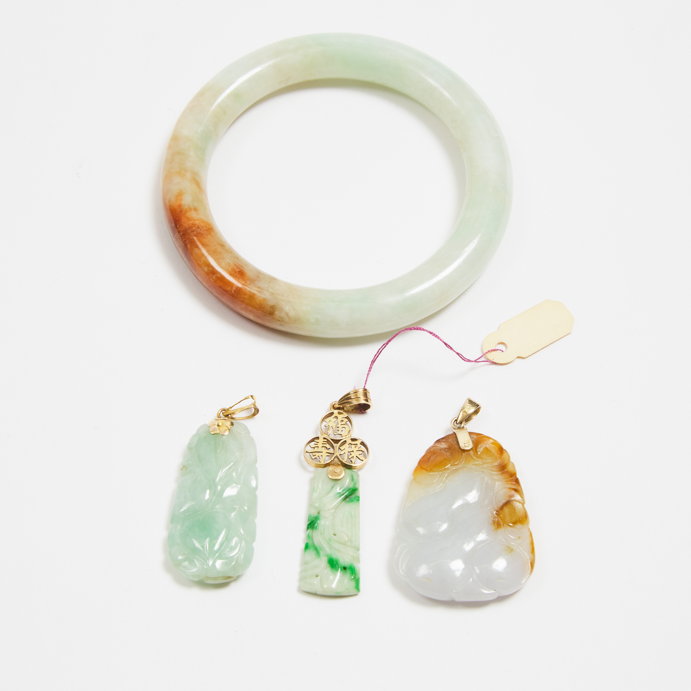 A Group of Four Natural Jadeite Pendants and Bangle, Republican Period