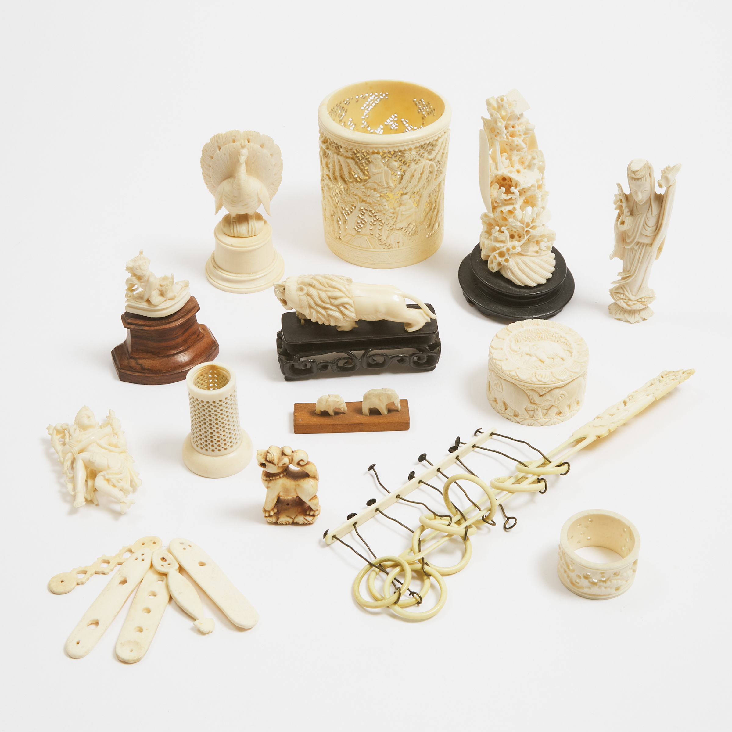 A Large Group of Fourteen Chinese, Indian, and Other Miscellaneous Ivory Carvings, 19th/Early 20th Century
