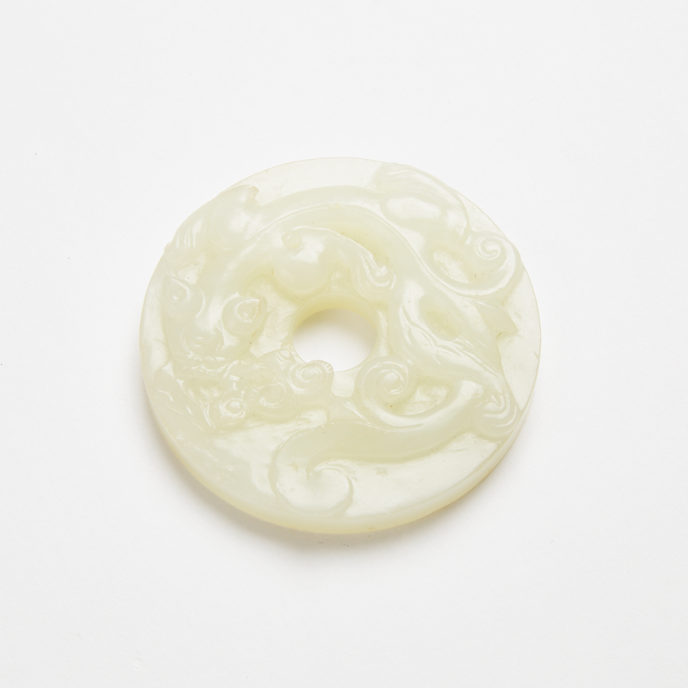A White Jade 'Chilong' Bi Disc, Ming/Qing Dynasty