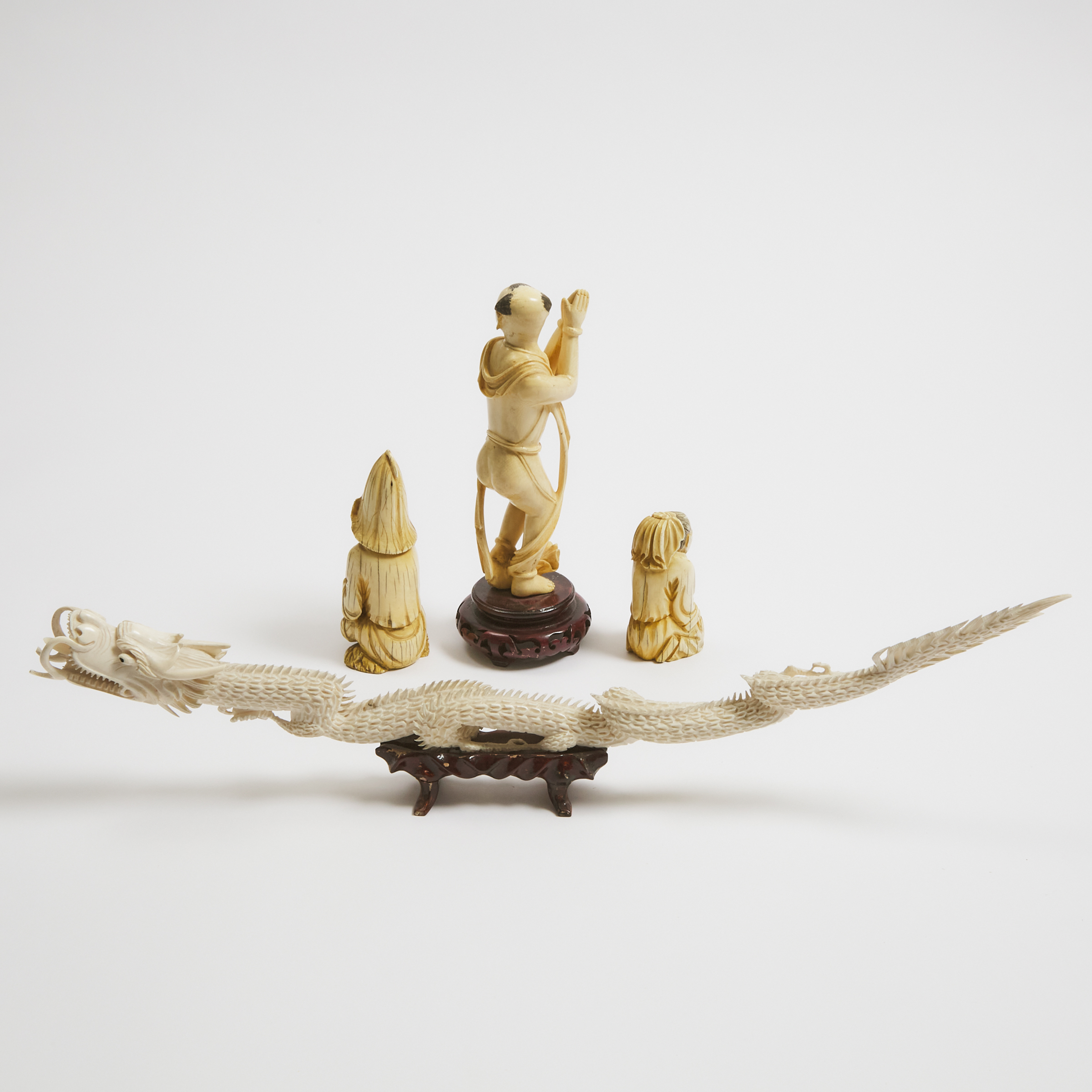 A Group of Four Ivory Carvings, 19th/20th Century