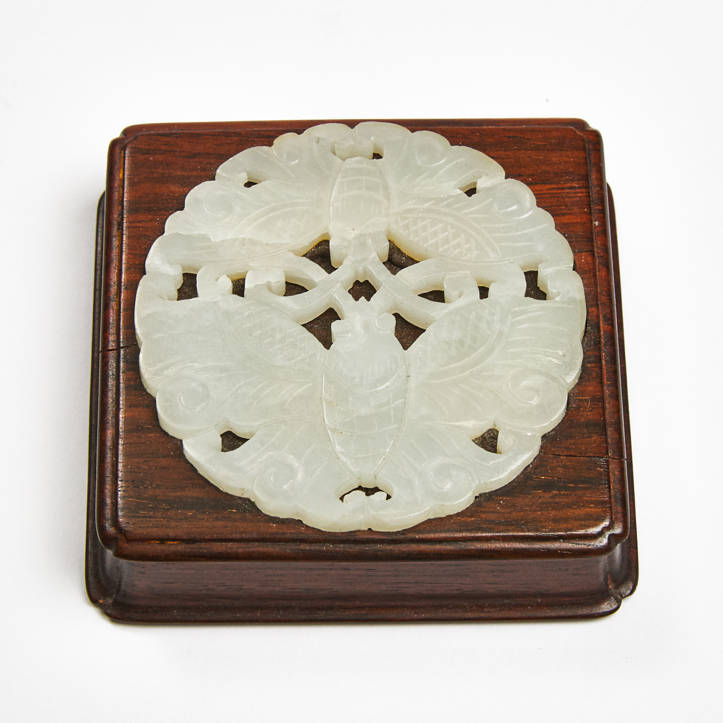 A White Jade 'Double-Butterfly' Plaque Inset Rosewood Paperweight, Qing Dynasty