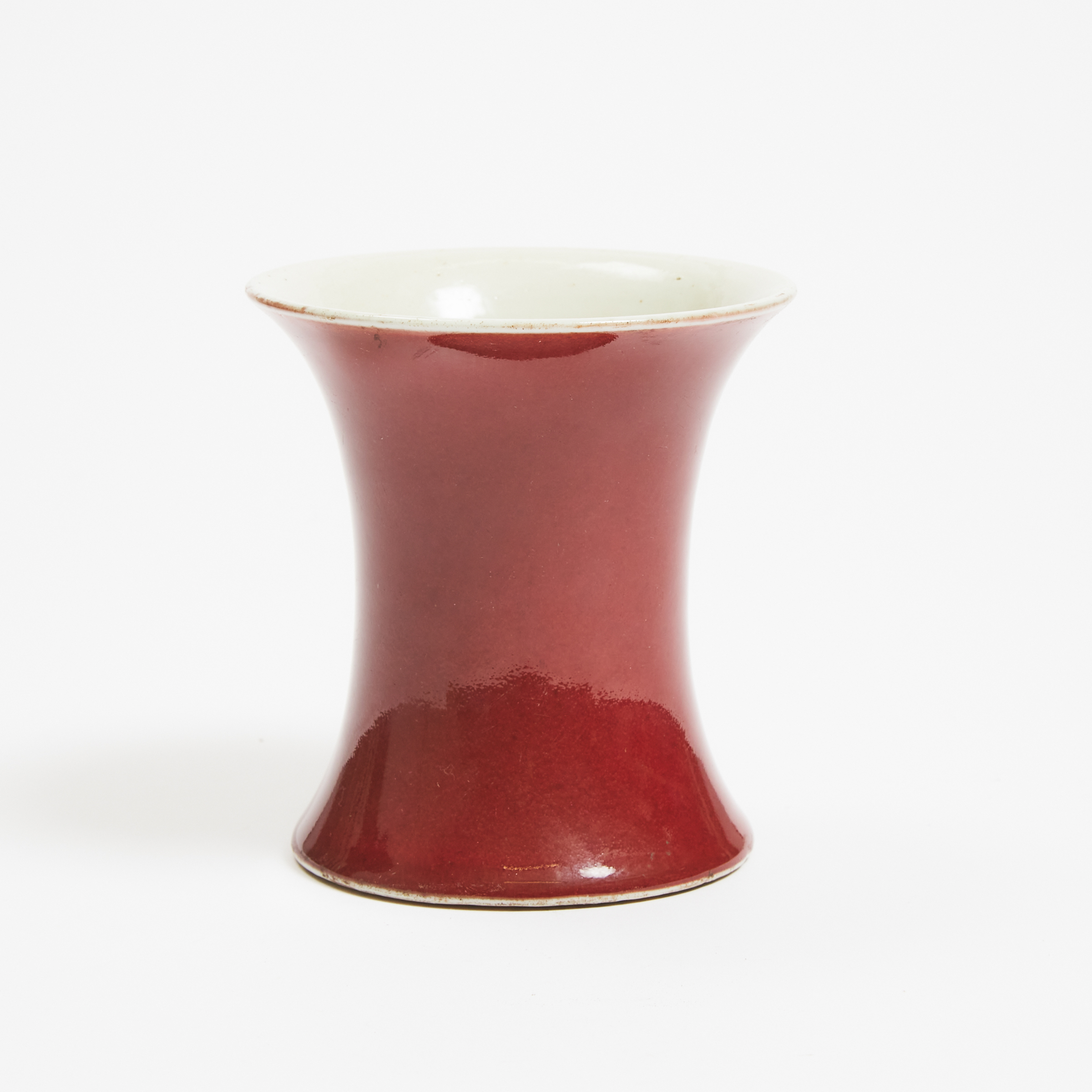 A Small Waisted Copper-Red Vase, 19th Century