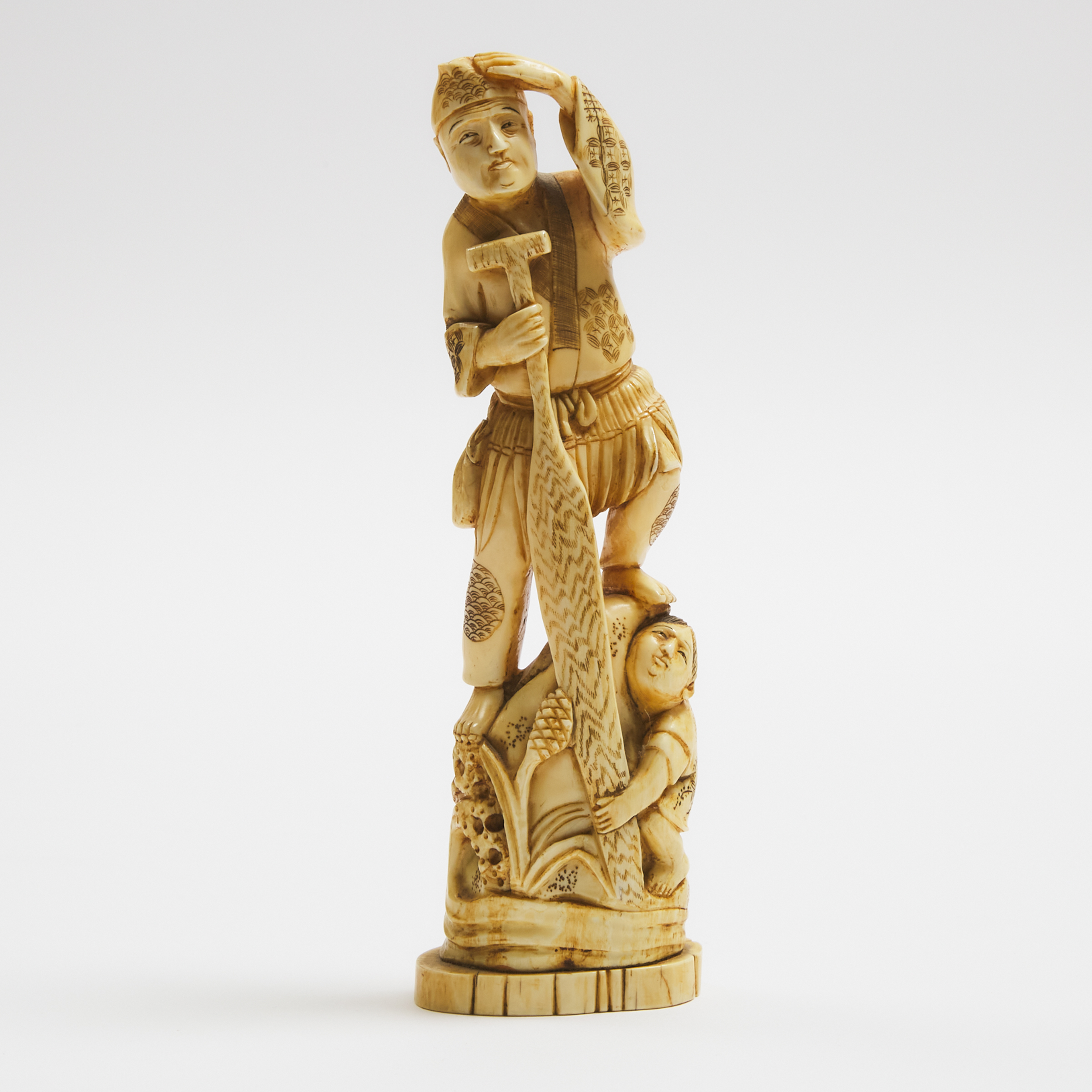 An Ivory Okimono of a Fisherman with a Paddle, Early to Mid 20th Century