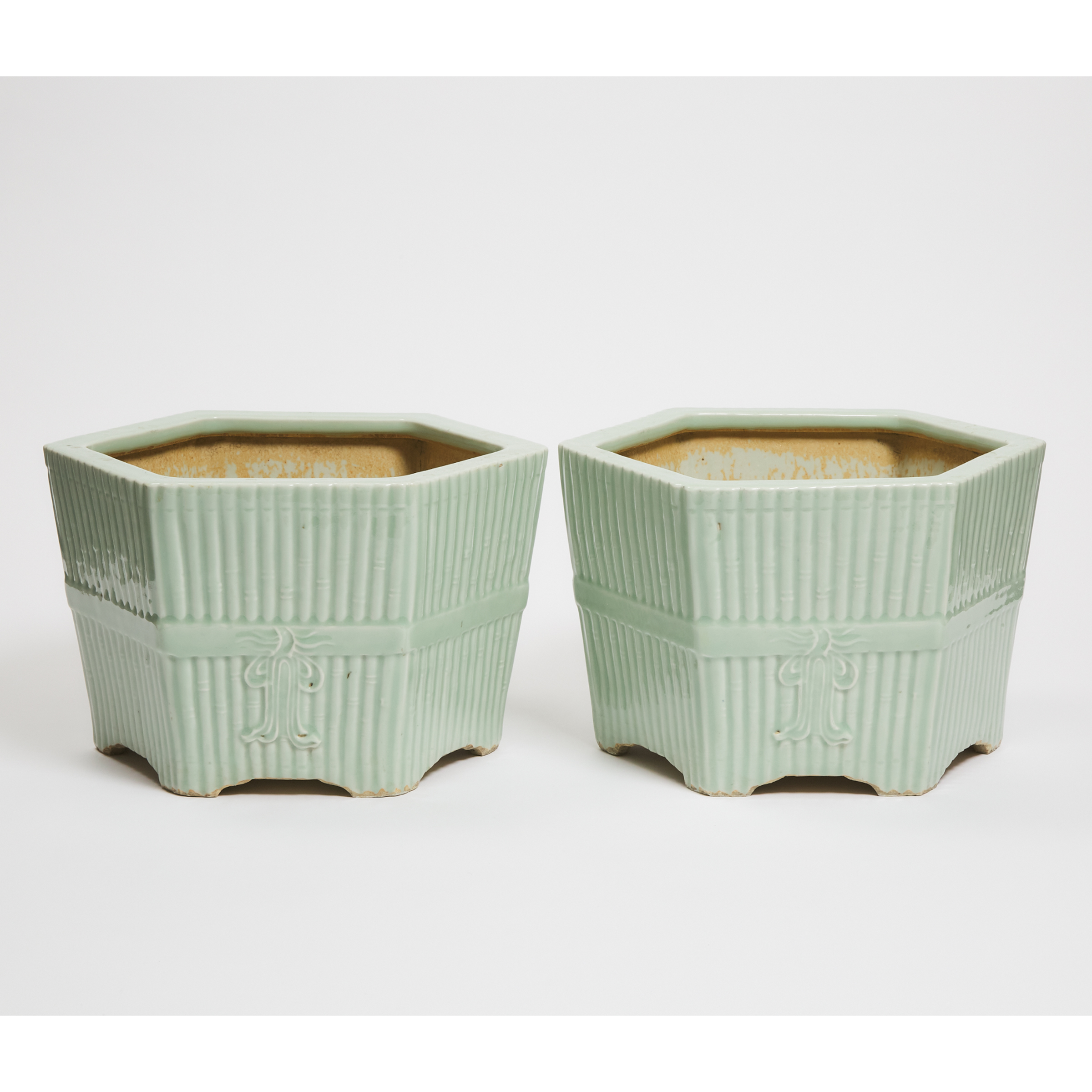 A Pair of Chinese Celadon-Glazed Hexagonal 'Bamboo' Jardinières, Late Qing/Republican Period