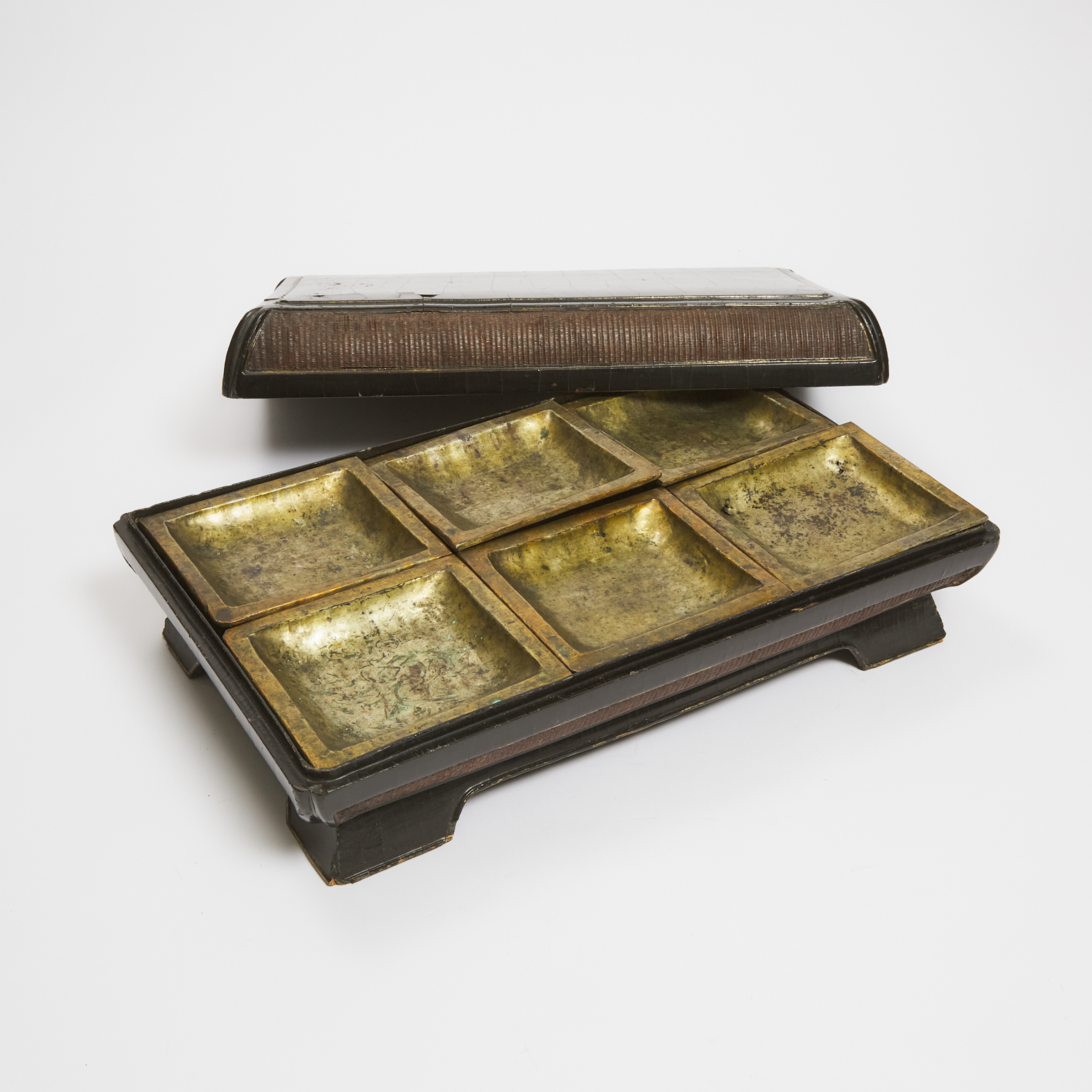A Chinese Gilt Lacquered Rectangular Box and Cover with Six Interior Trays, 19th Century