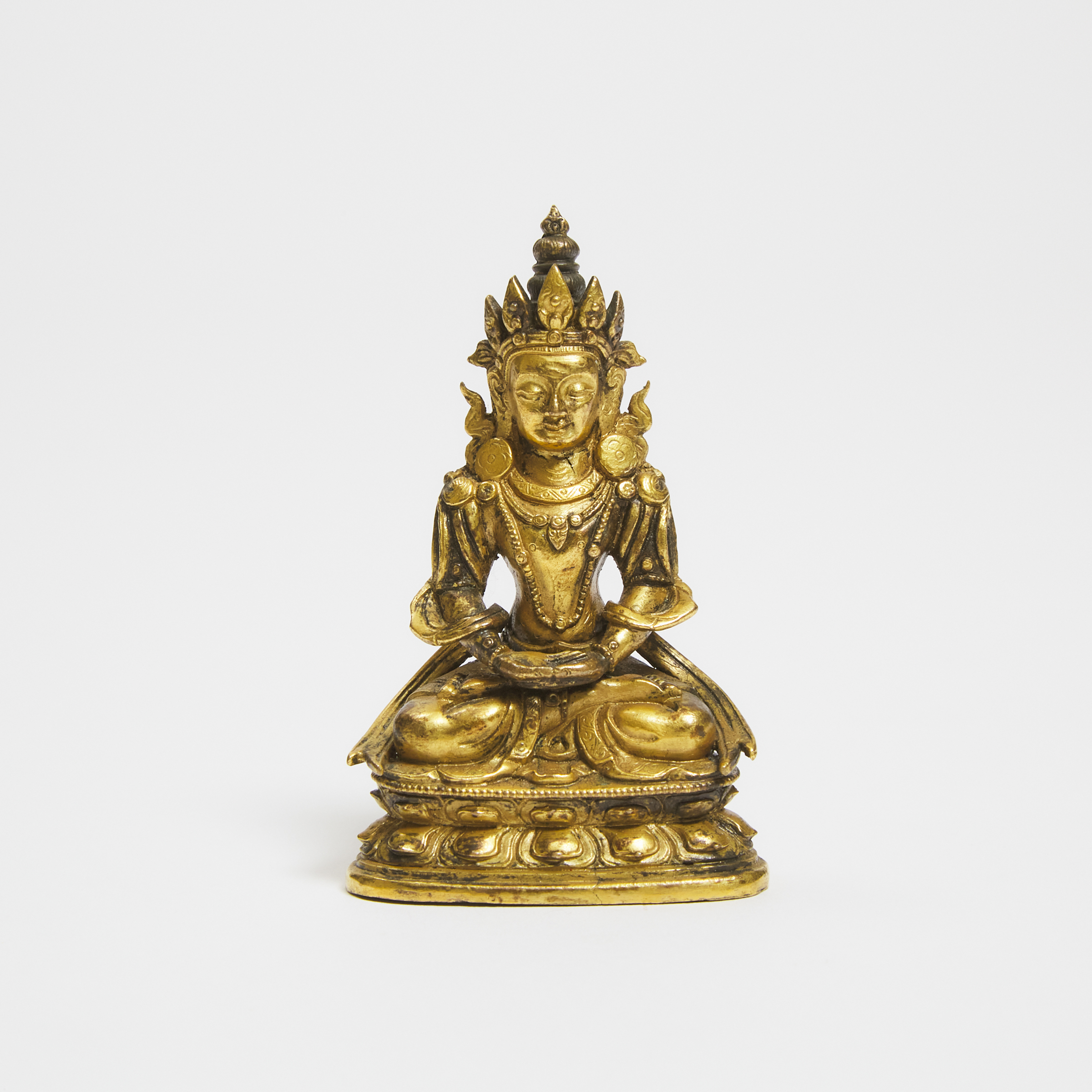 A Small Tibetan Gilt Bronze Seated Figure of Buddha, 18th Century