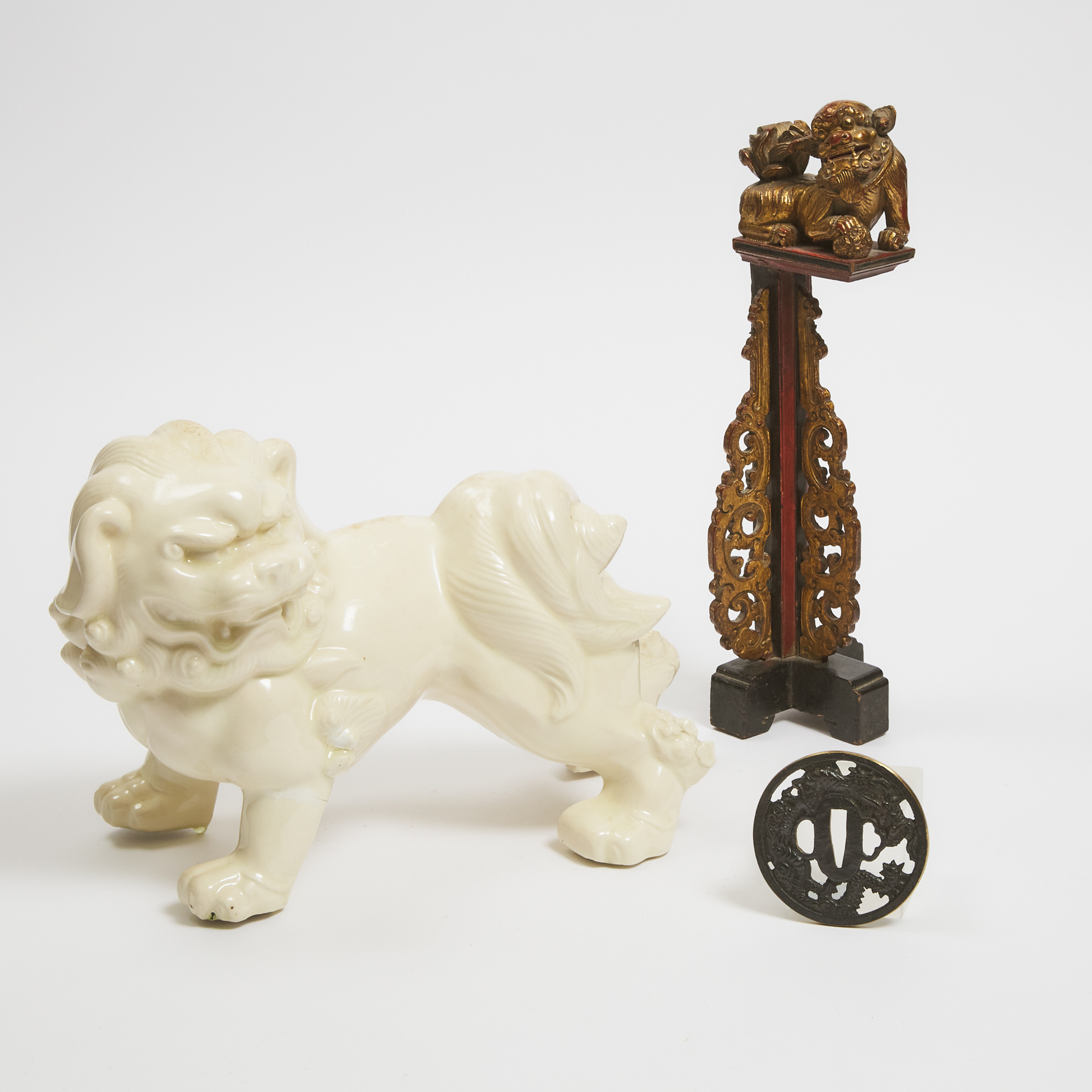 A White Glazed Ceramic Foo Dog, Together With a Gilt Wood Bracket and a Japanese Tsuba, 19th/20th Century