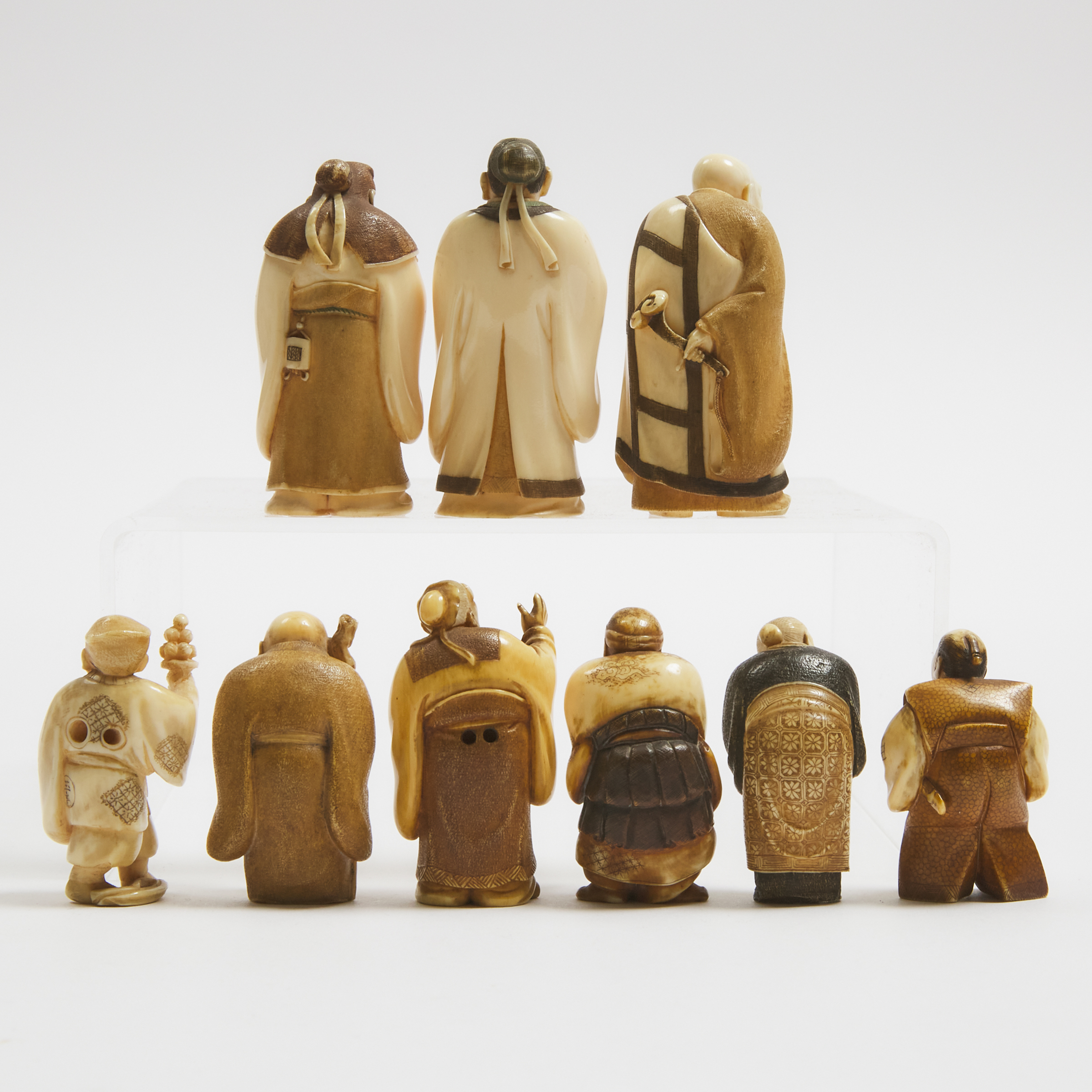 A Group of Nine Small Ivory Figural Okimono, Meiji Period and Later