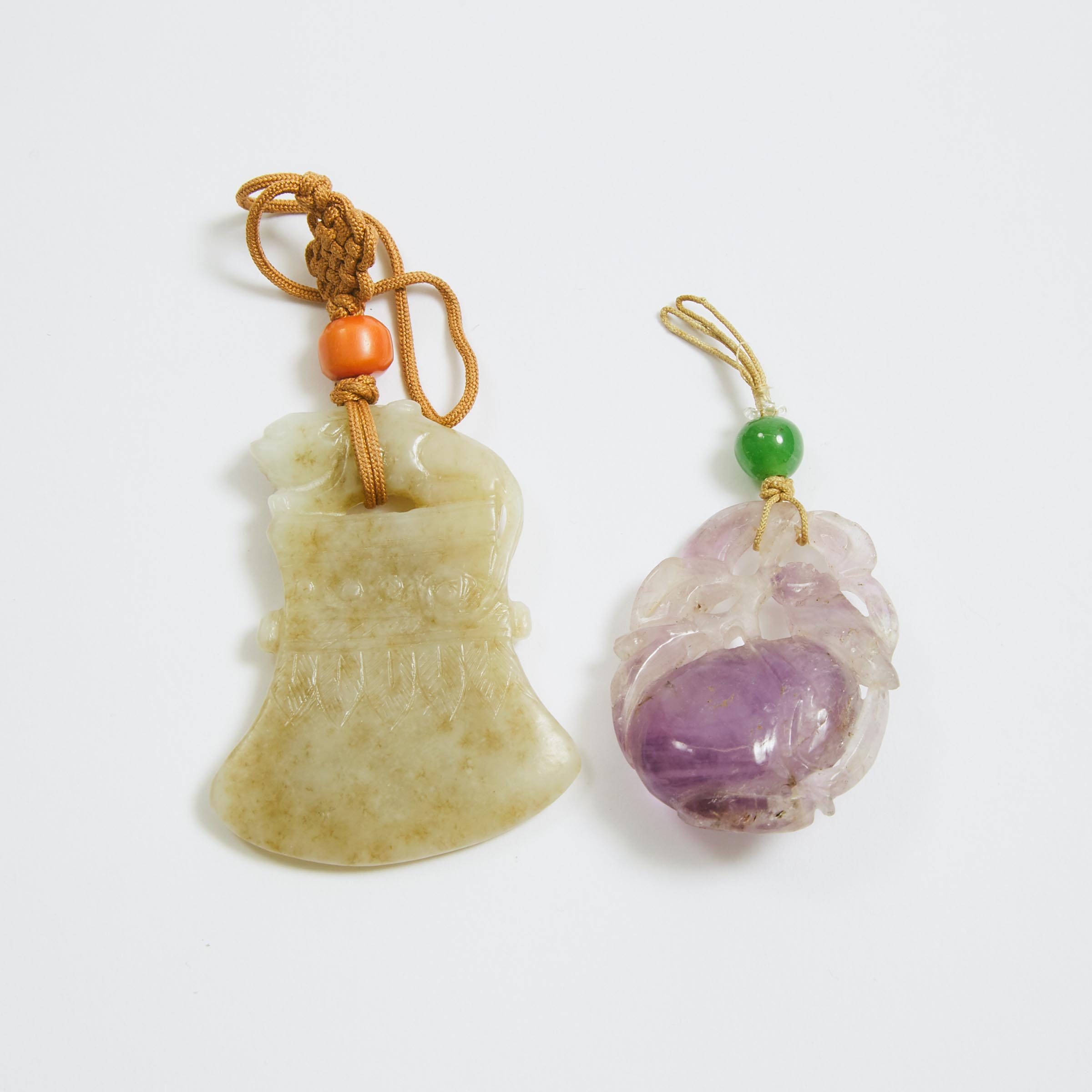 A White and Russet Jade Axe-Form Pendant, Together With an Amethyst 'Magpie and Peach' Pendant, Ming/Qing Dynasty