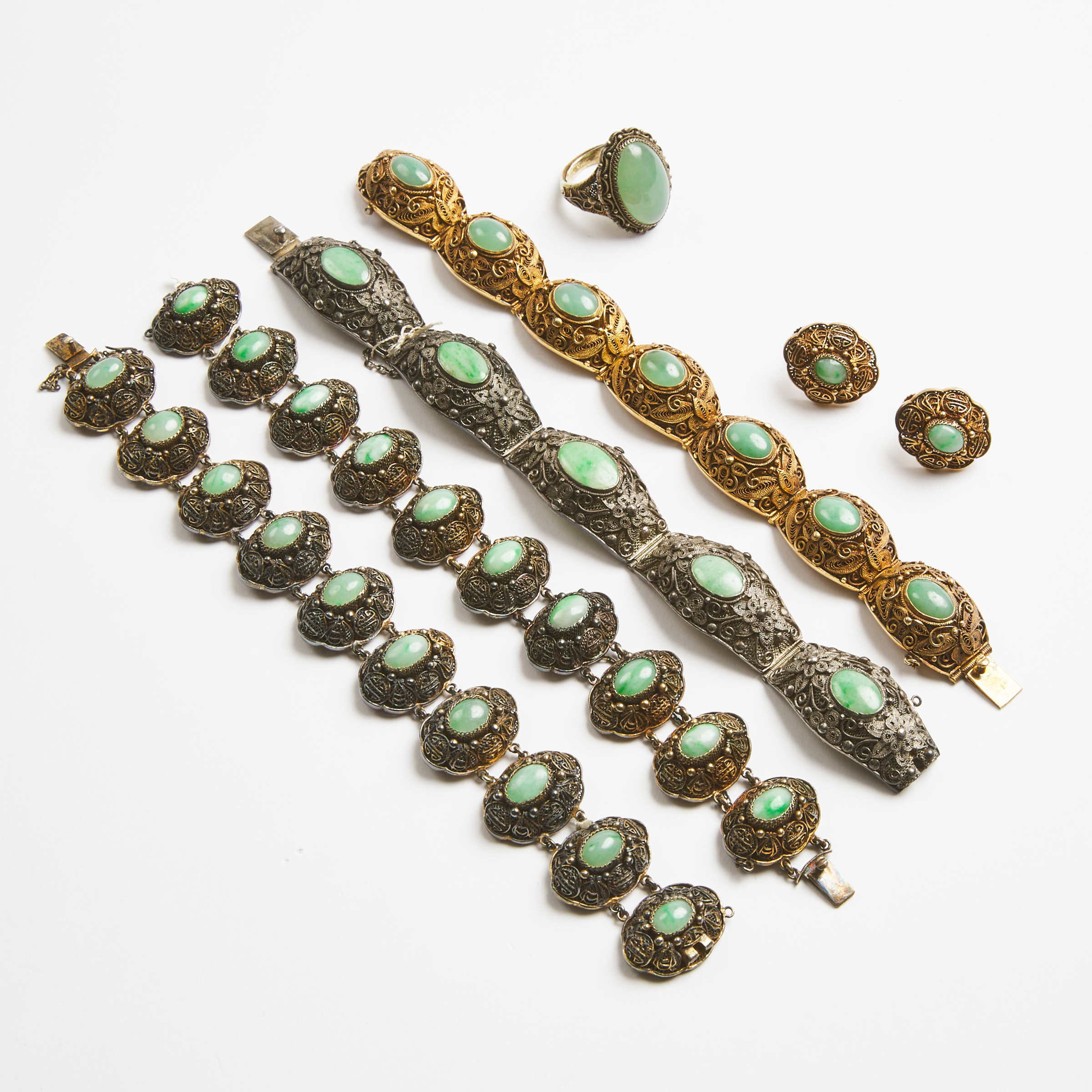 Four Strands of Gilt-Silver Filigree Jadeite-Inset Bracelets, Together With a Pair of Earrings, Late 19th/Early 20th Century