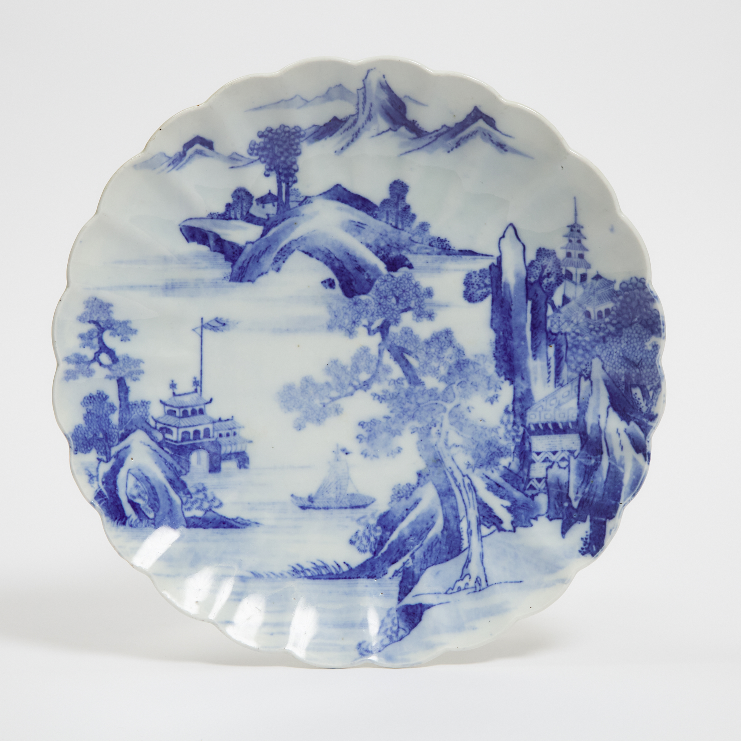 A Large Blue and White 'Landscape' Floral Charger, 19th Century