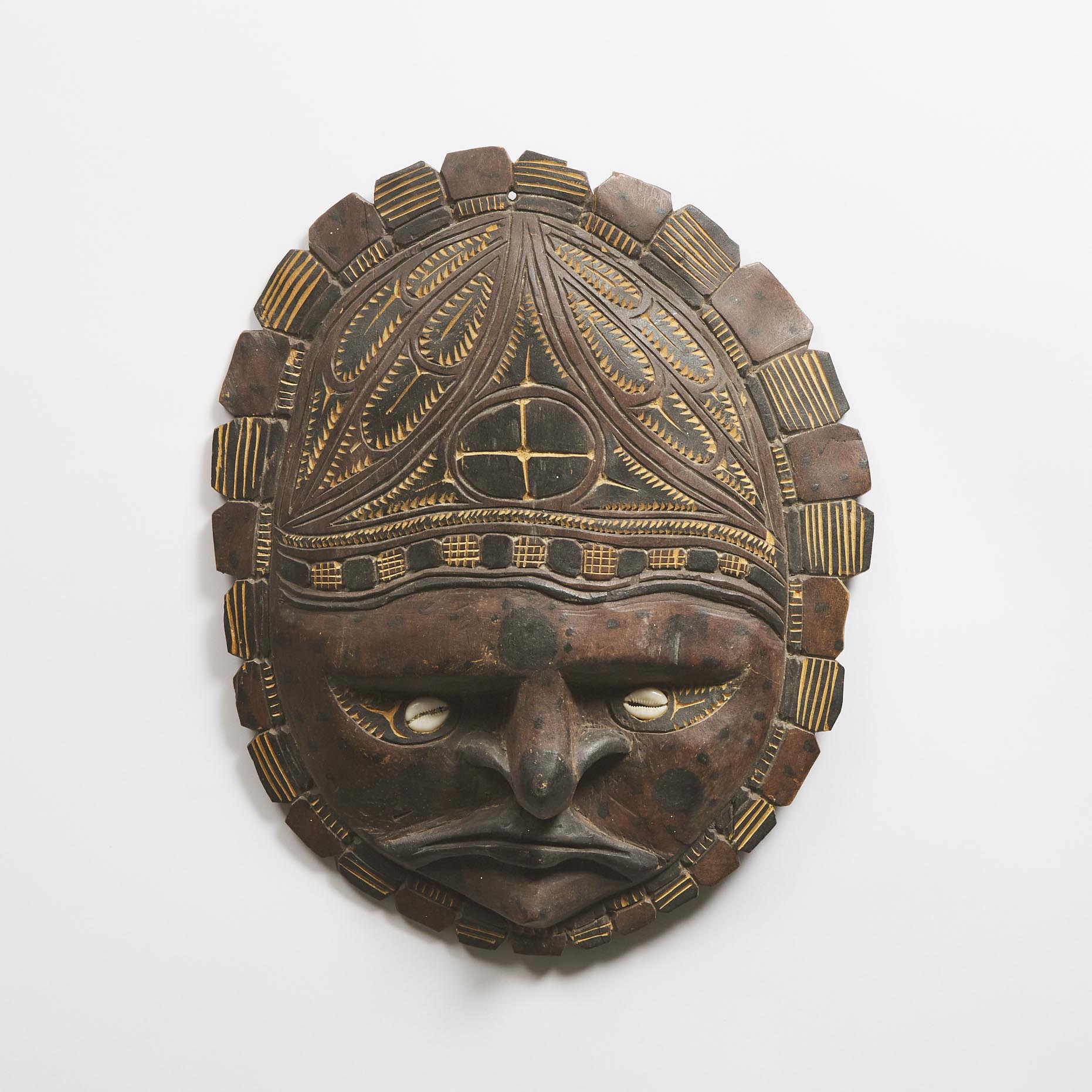 Papua New Guinea Carved Wood Turtle Shell Form Mask, late 20th century