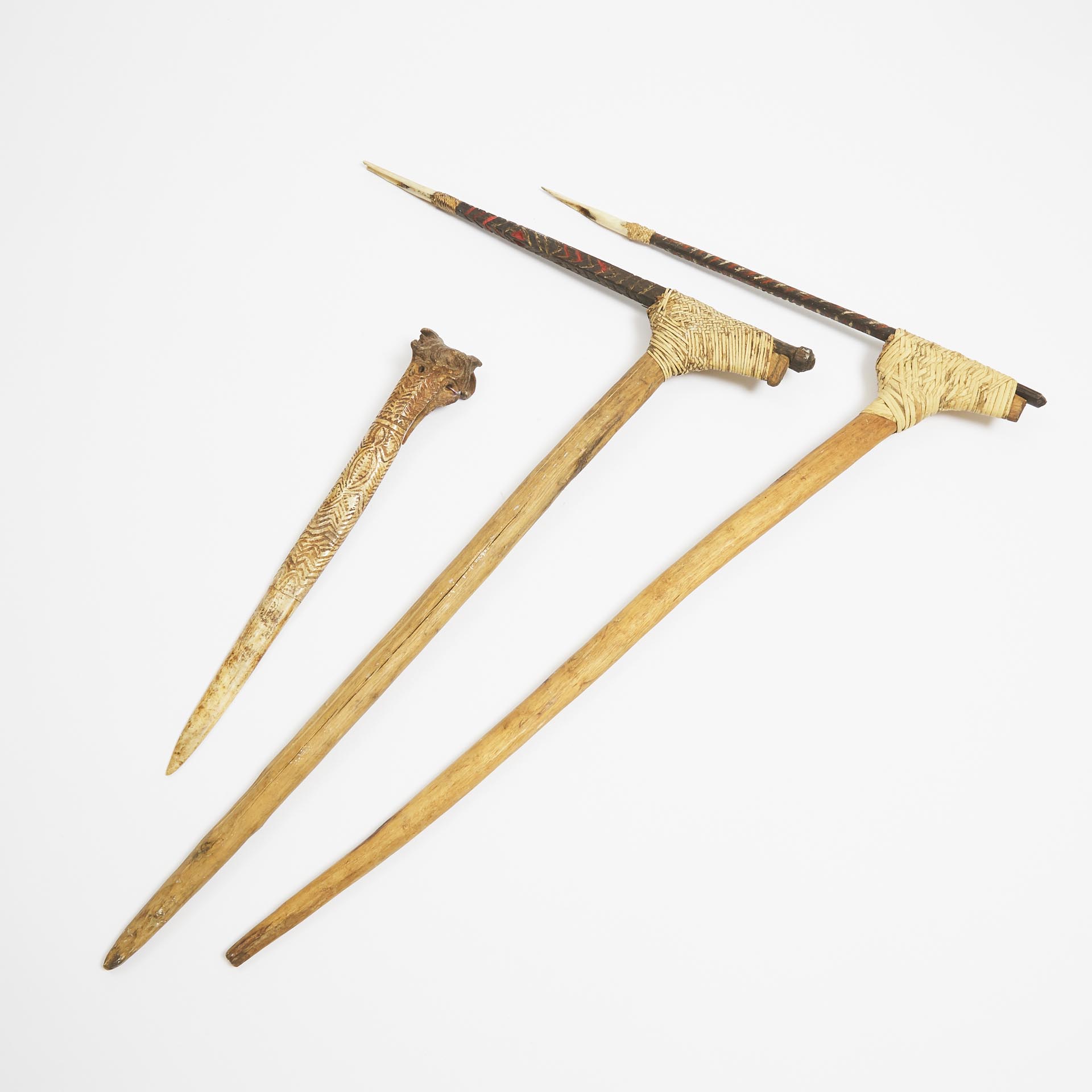 Middle Sepik Cassowary Bone Dagger, early 20th century together with two Pig Killing Sticks, mid to late 20th century, Papua New Guinea