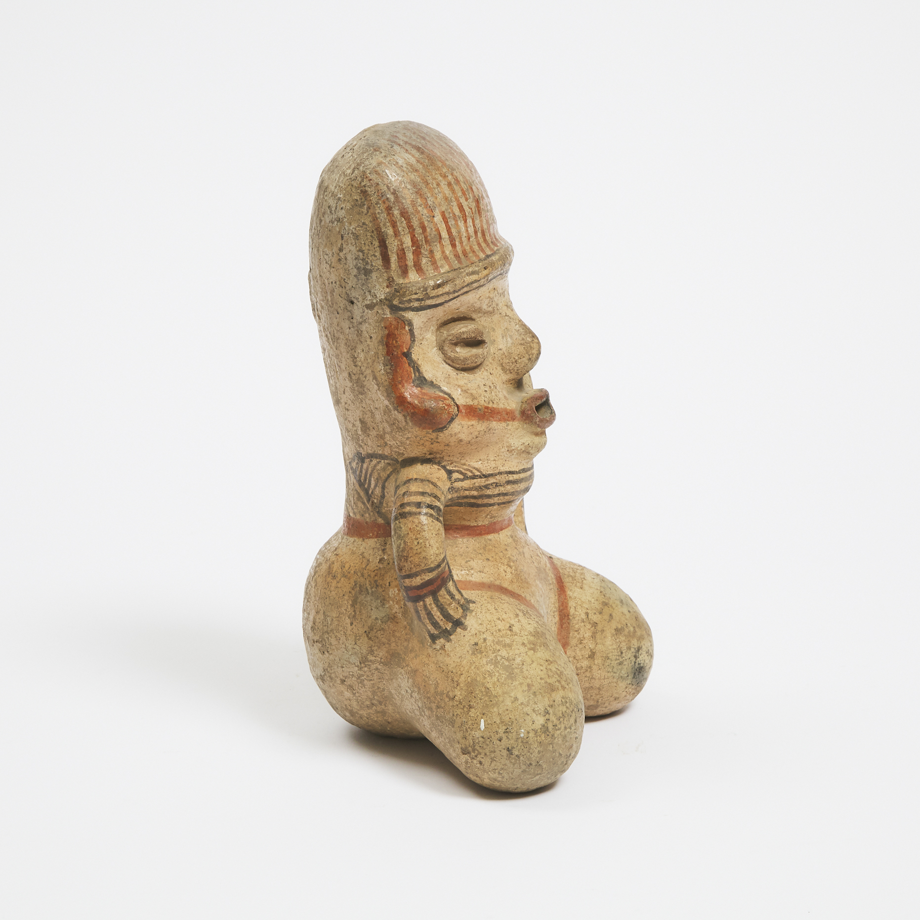 Pre-Columbian Polychrome Painted Pottery Kneeling Figure, possibly Nicoya, Costa Rica, 800-1200 AD