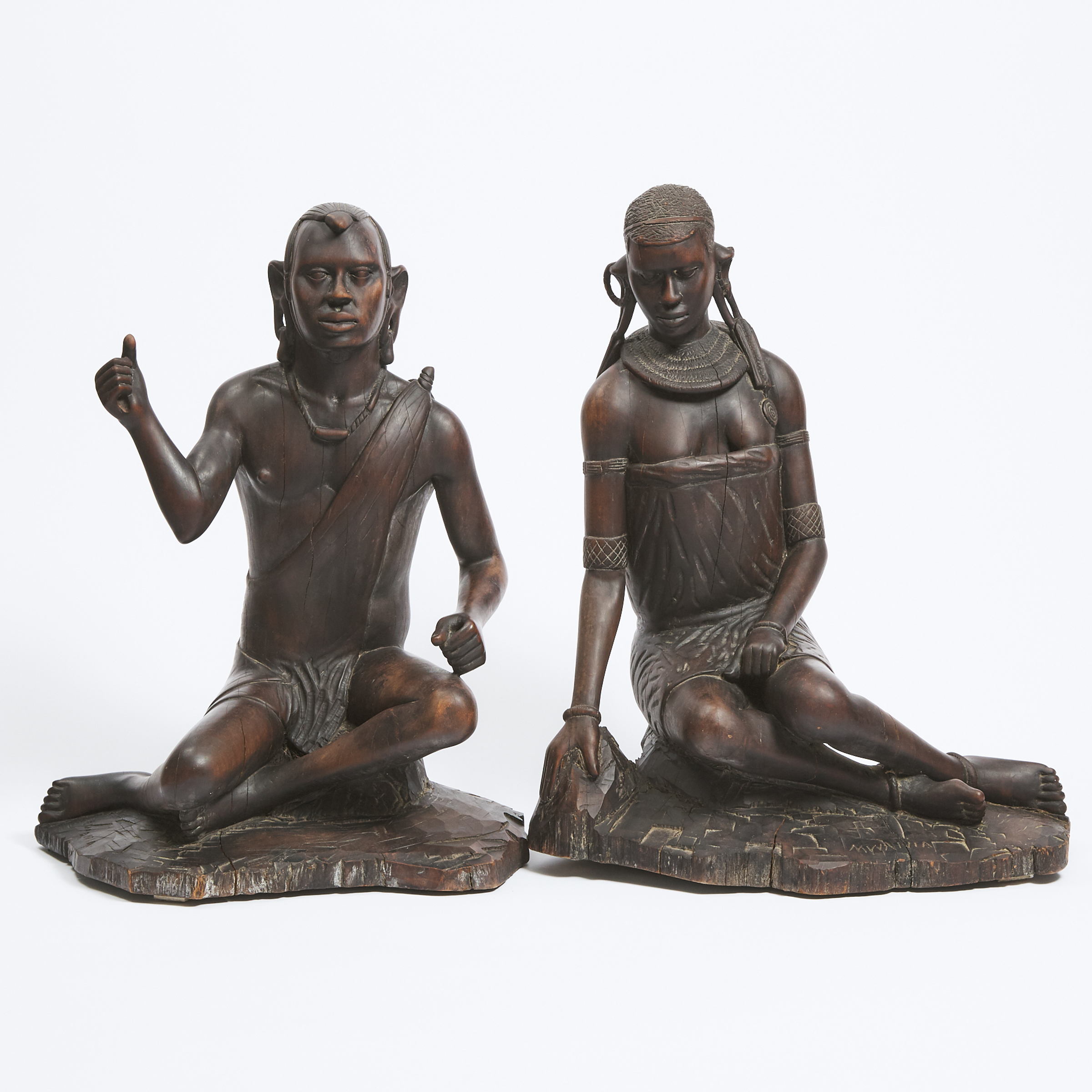 Pair of Maasai Carved Hardwood Seated Male and Female Figures, Kenya/Tanzania, East Africa, 20th century