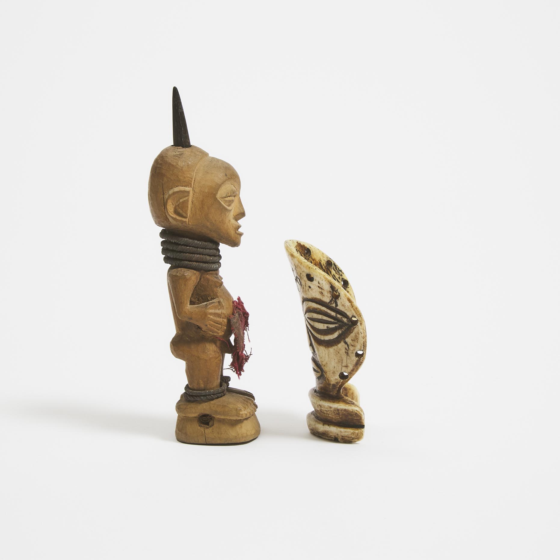Chokwe Carved Bone Head together with a Small Songye Power Figure, Democratic Republic of Congo, both Central Africa, 20th century