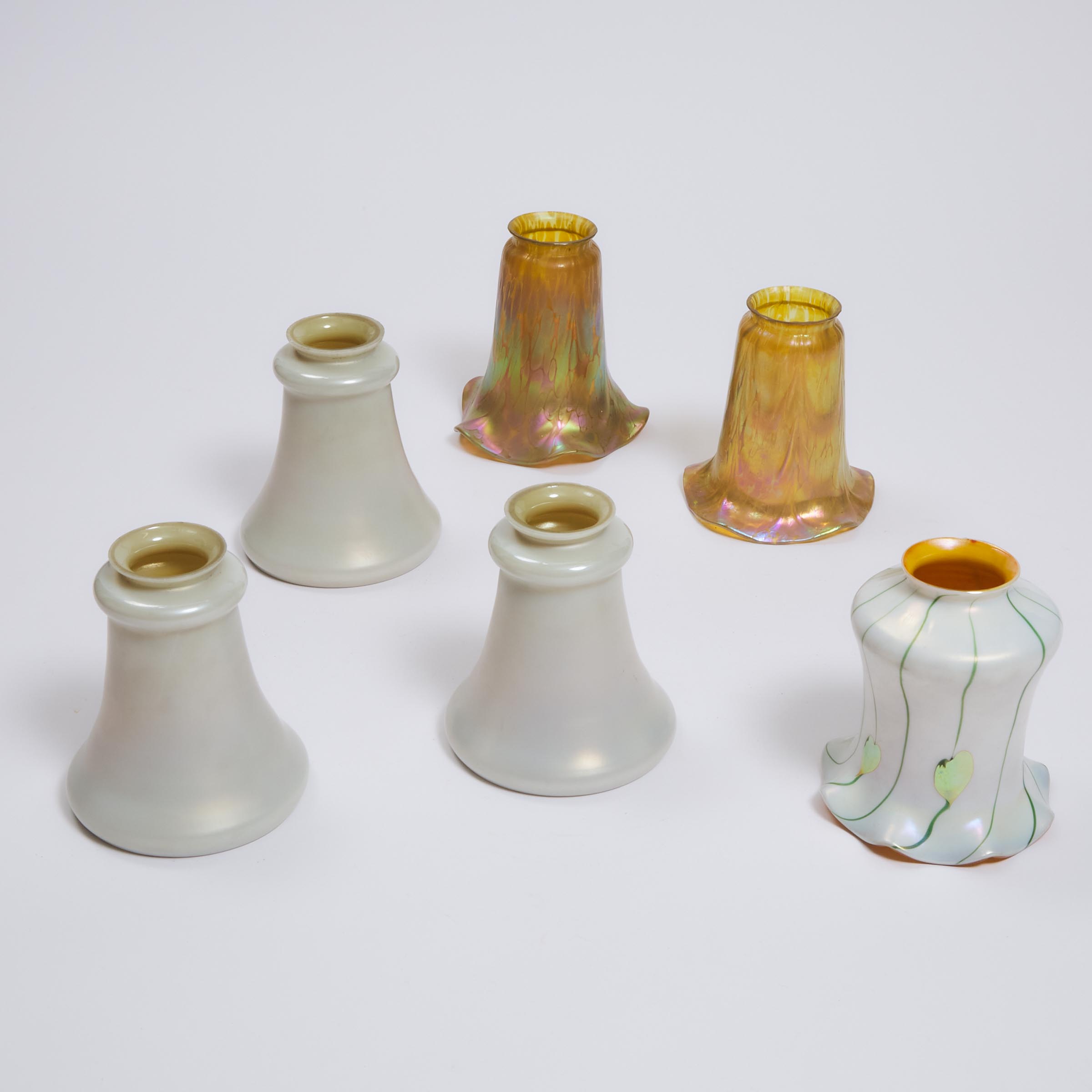 Six Various Iridescent and Calcite-Type Glass Shades, early 20th century