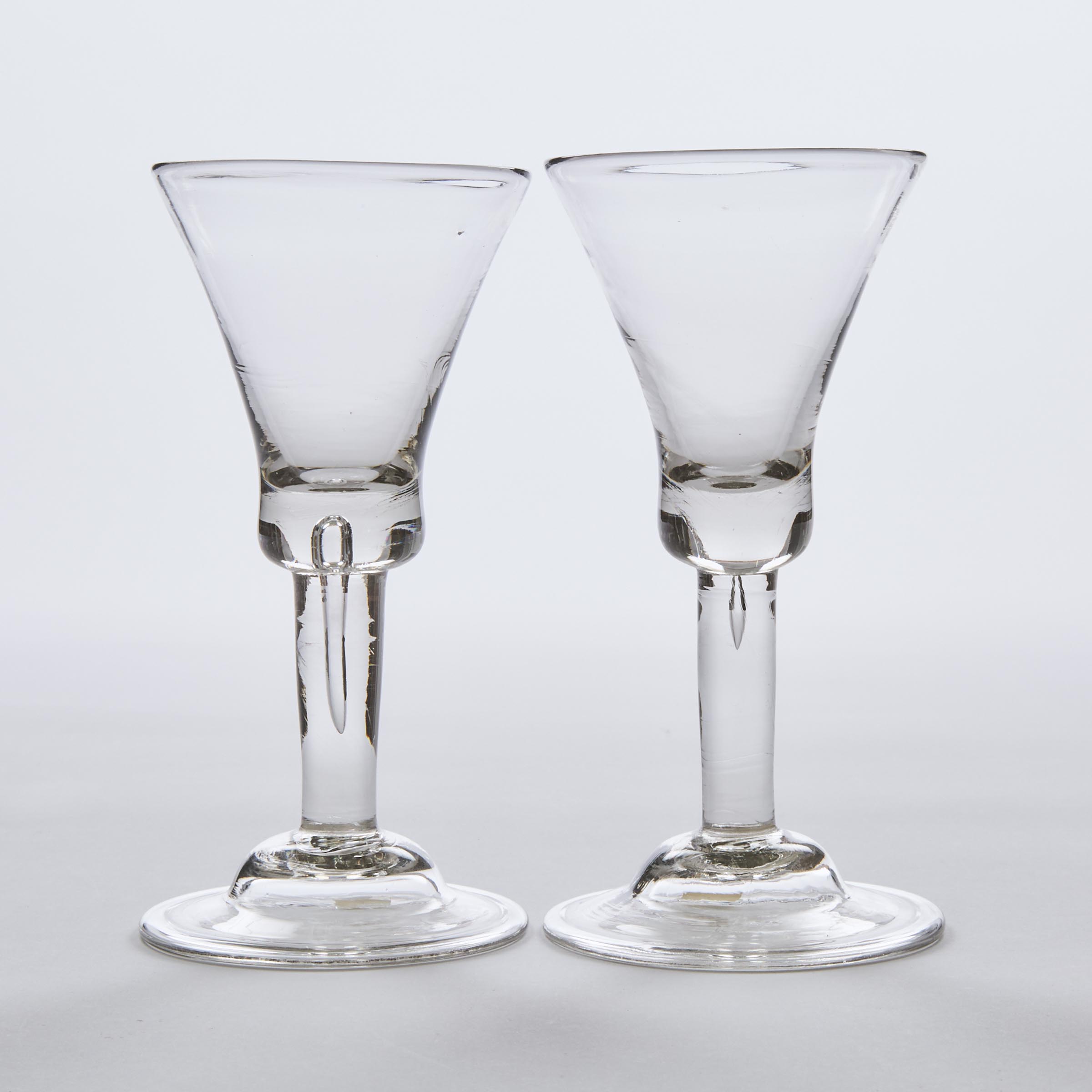 Pair of English Teared Plain Stemmed Wine Glasses, mid-18th century