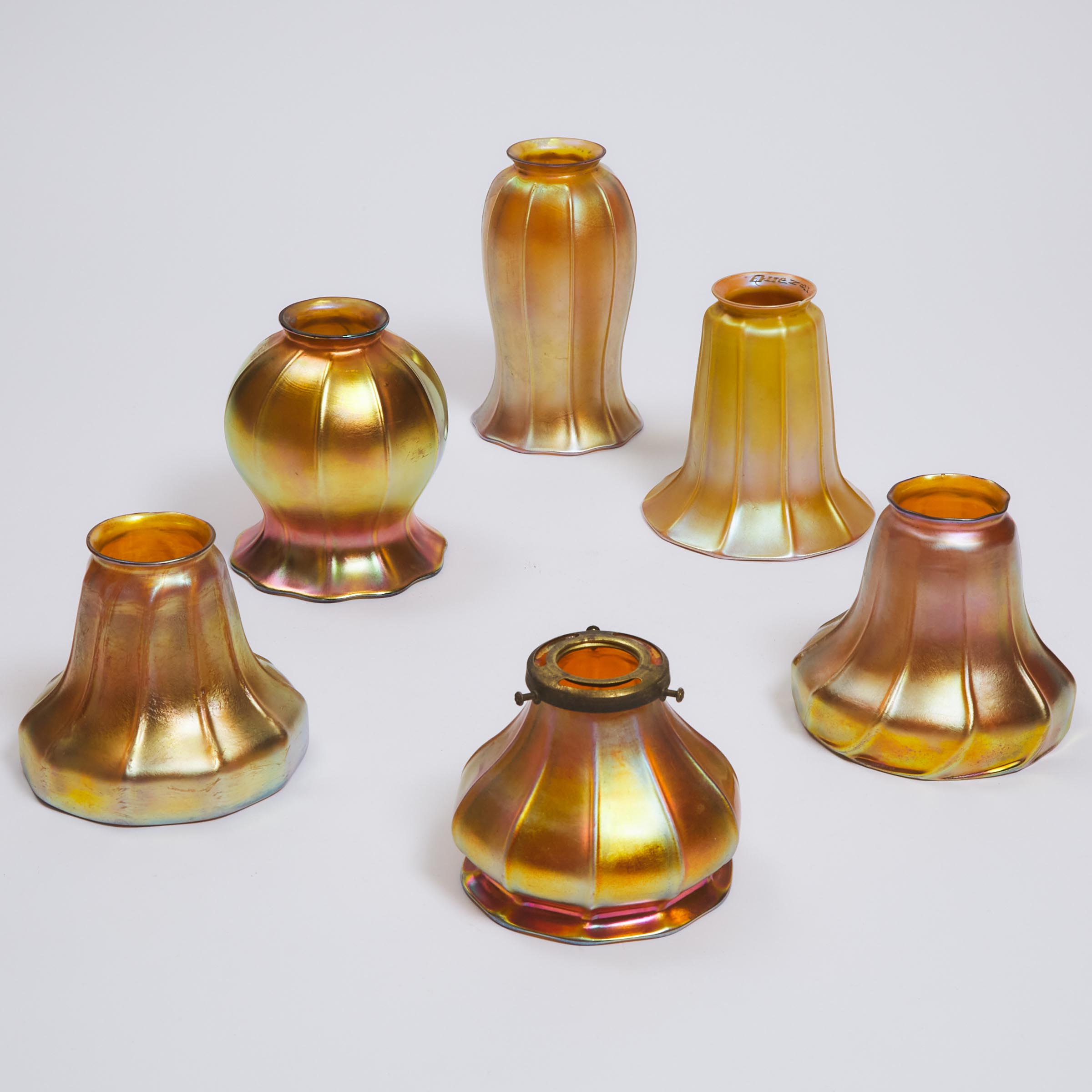 Six Various Steuben, Quezal, and Other American Iridescent Glass Shades, early 20th century