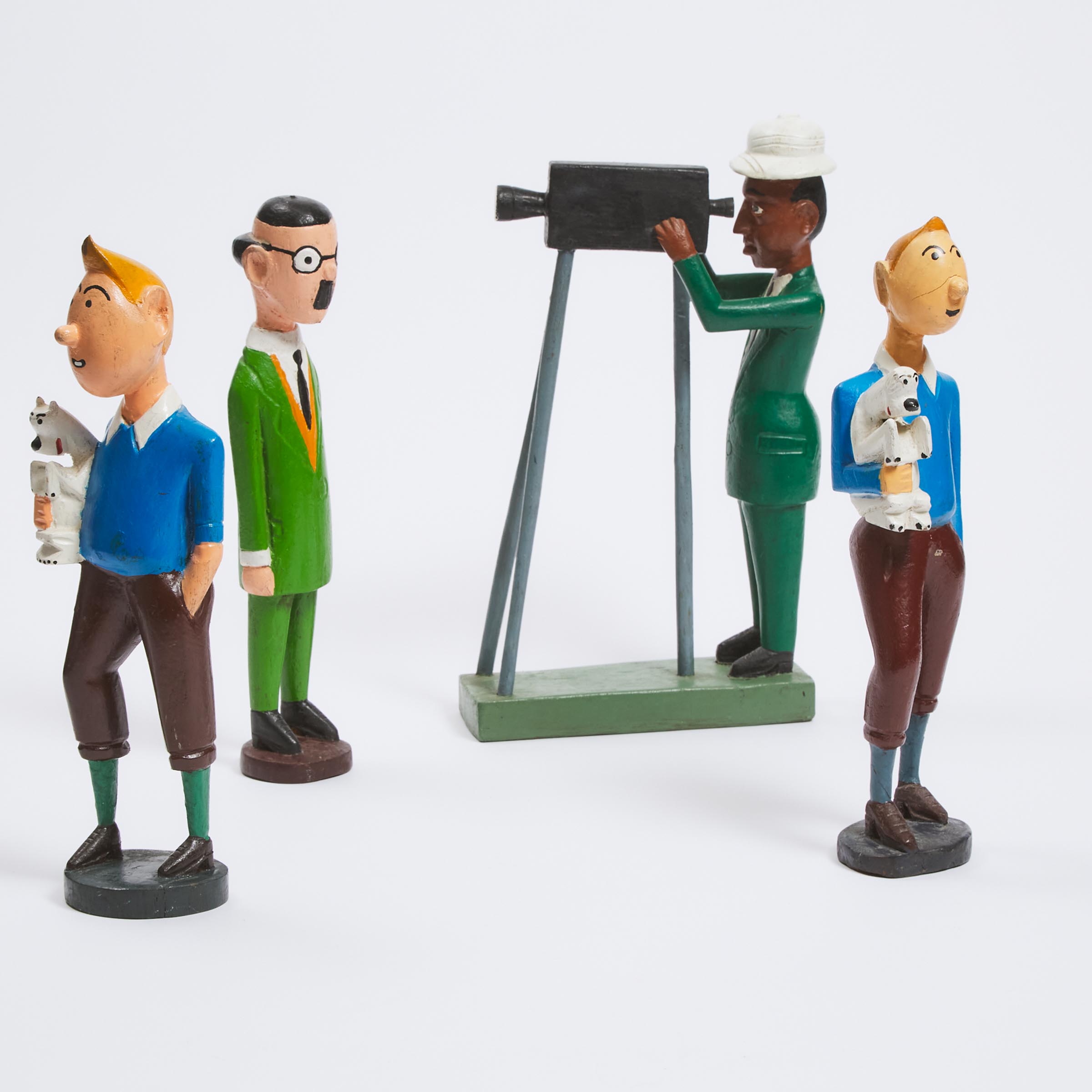 Four Carved and Polychromed Hardwood Models of 'Tintin' Characters, 20th century