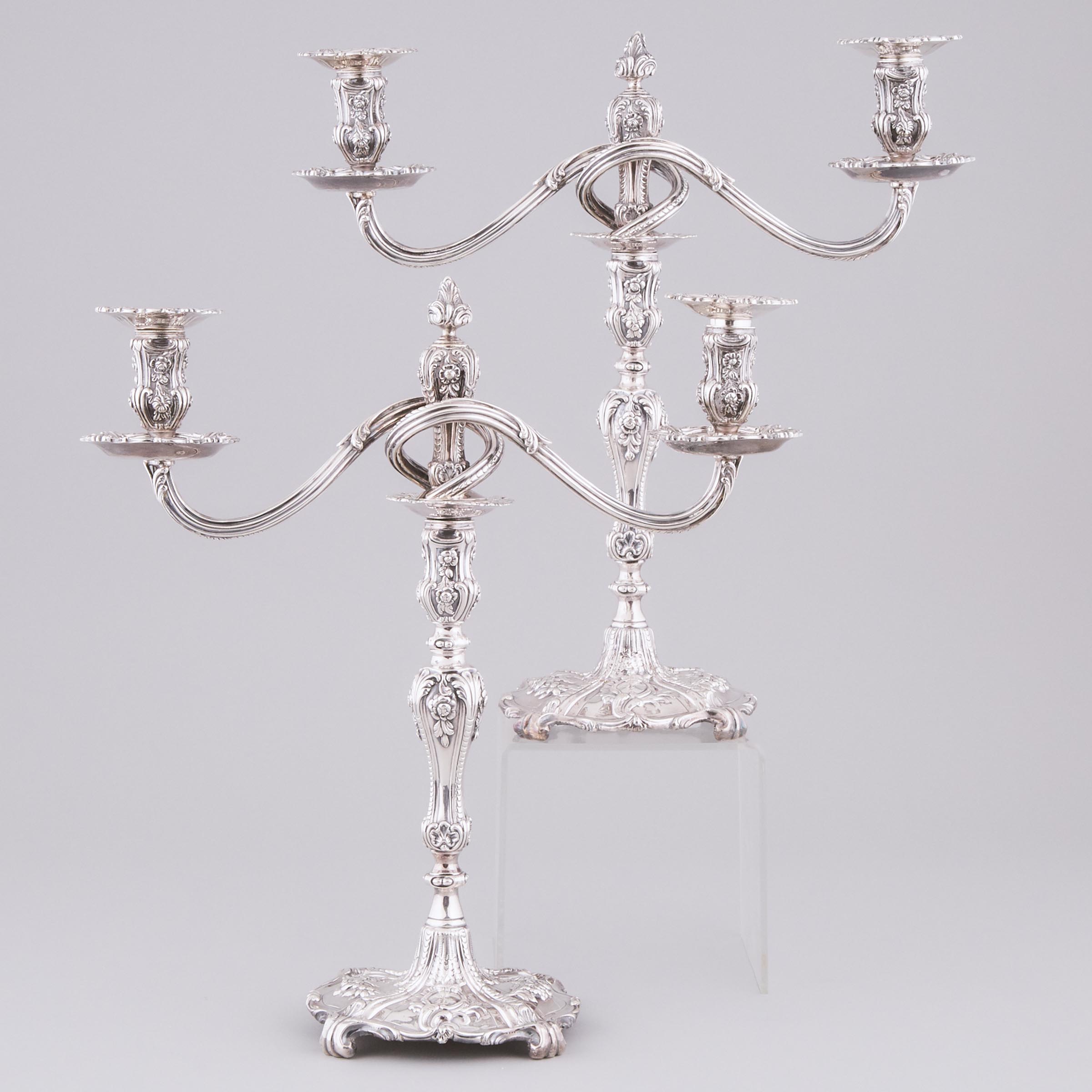 Pair of Georgian and Later Silver Two-Light Candelabra, the bases possibly Louis Herne, London, 18th century