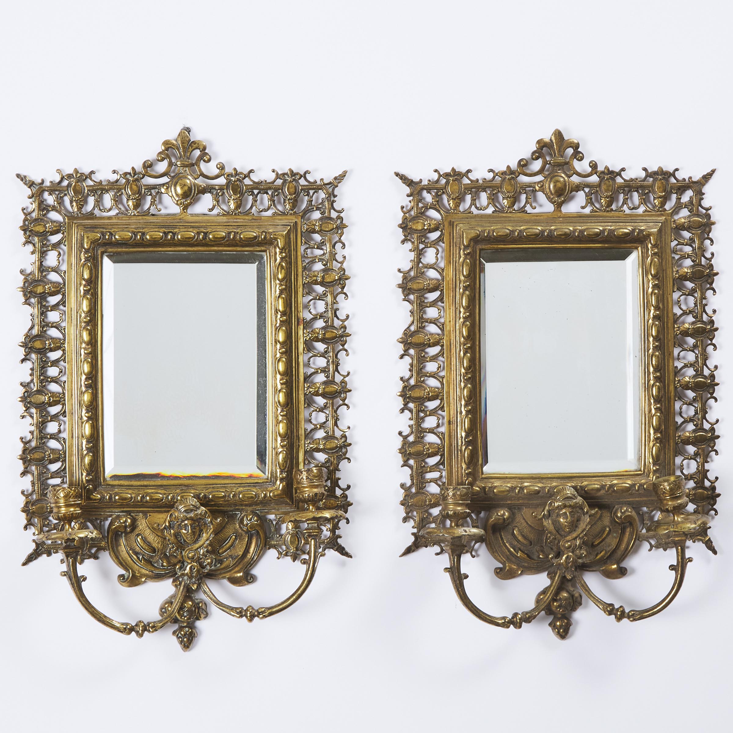Pair of Renaissance Revival Lacquered Brass Two Light Mirrored Wall Sconces, late 19th century