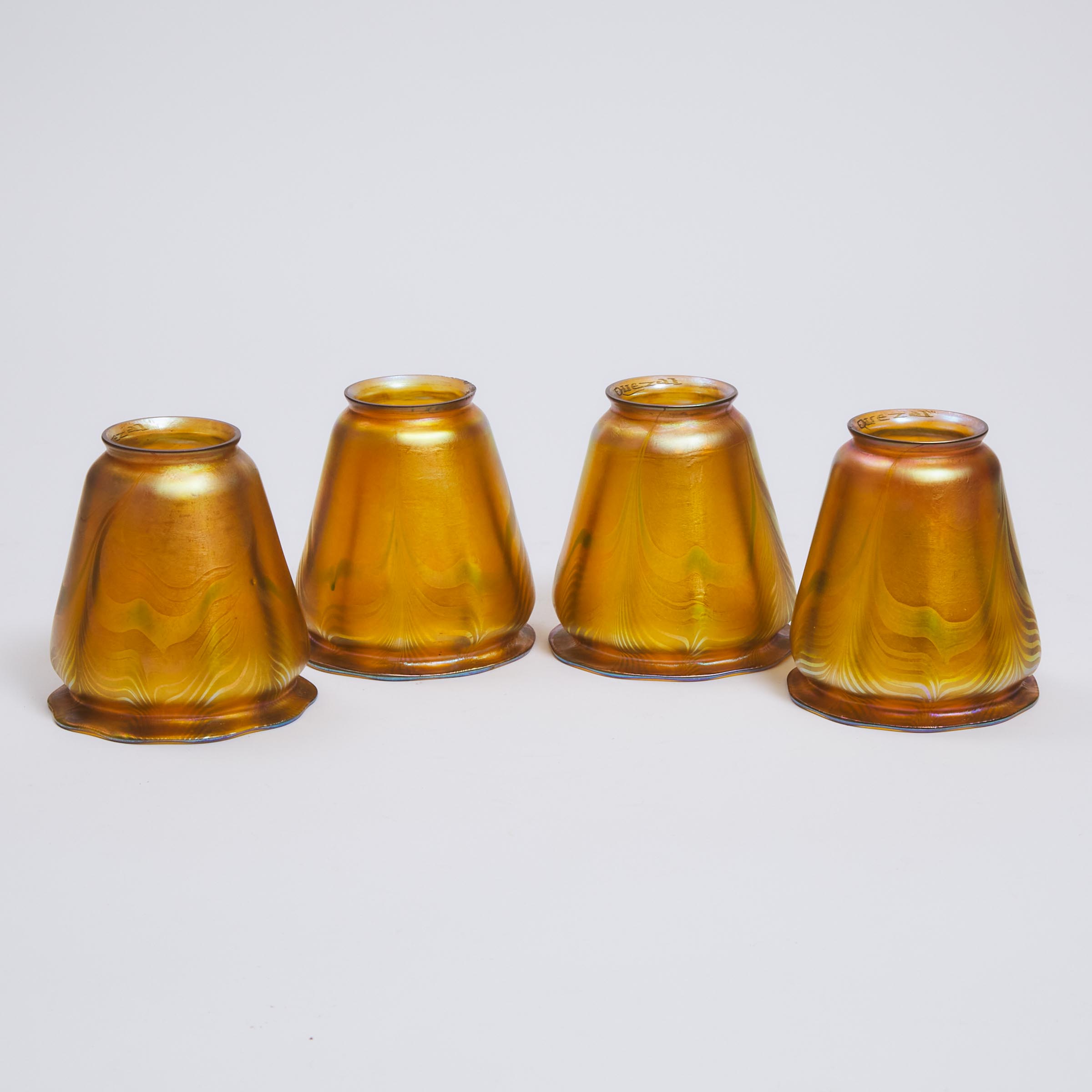 Four Quezal Decorated Iridescent Glass Shades, early 20th century