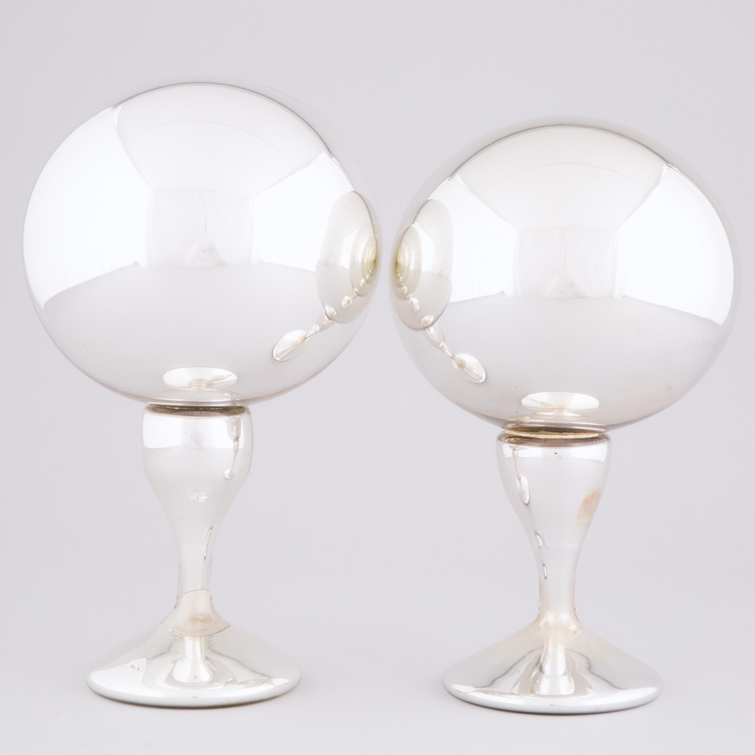 Two Mercury Glass Pedestal-Footed Witches' Balls, 19th century