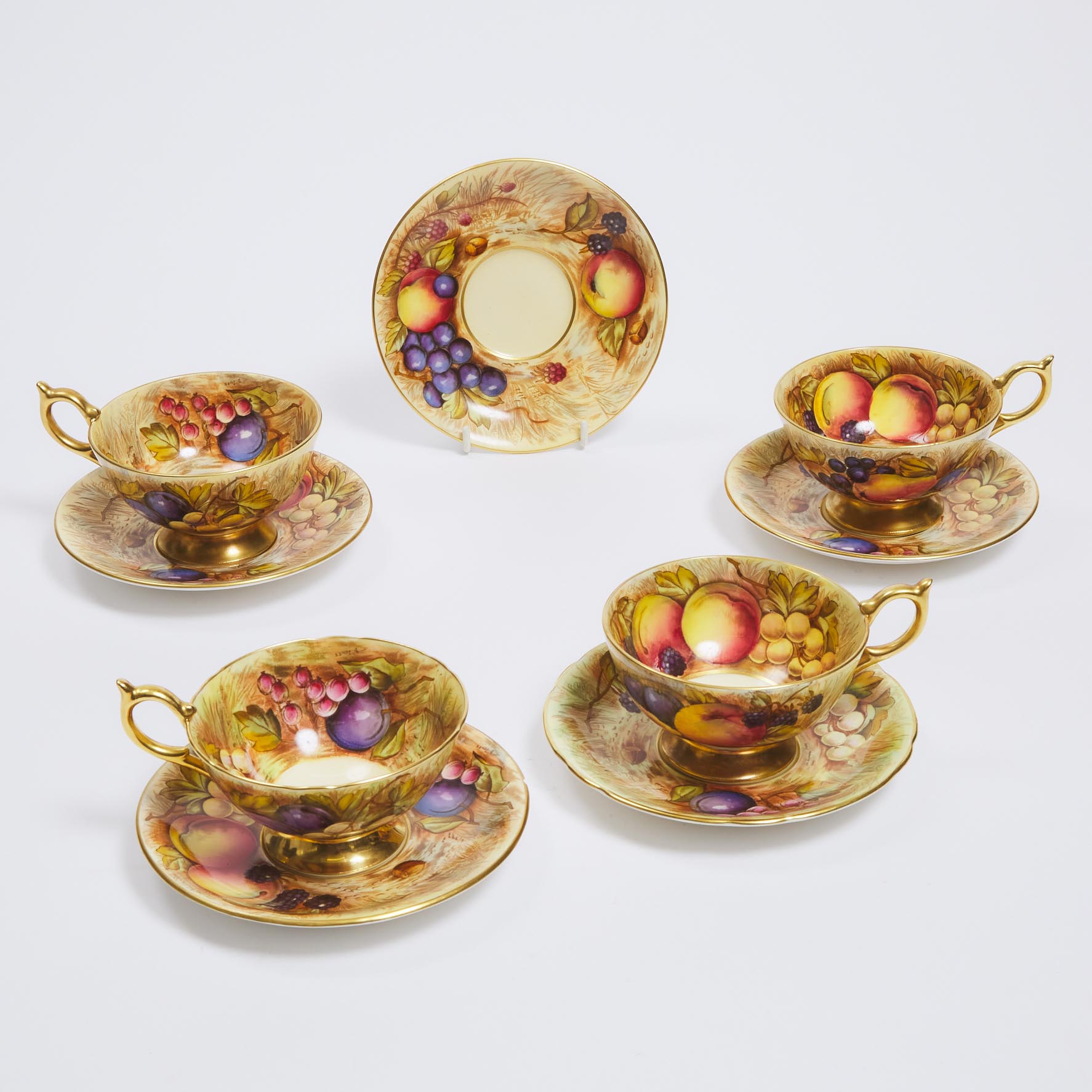 Four Aynsley 'Orchard Gold' Cups and Five Saucers, D. Jones and N. Brunt, 20th century