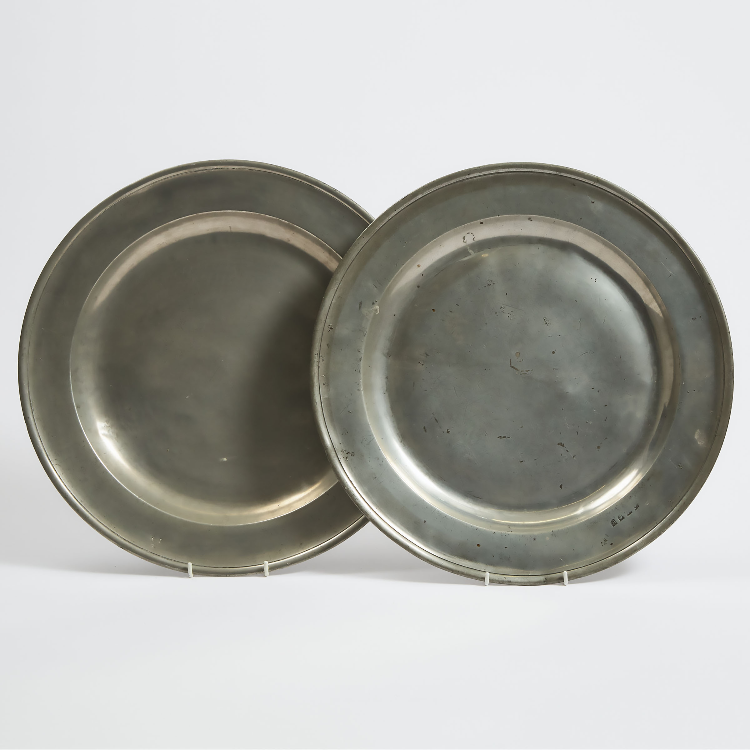 Two English Pewter Single Reed Chargers, 17th and early18th centuries