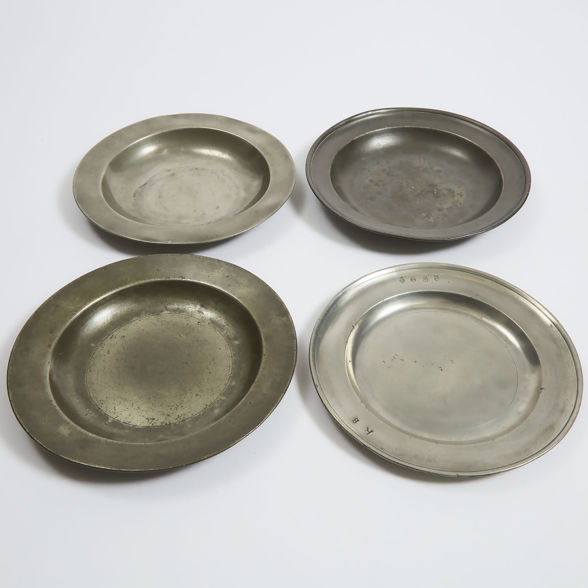 Four Early English Pewter Plates, 17th and early 18th centuries