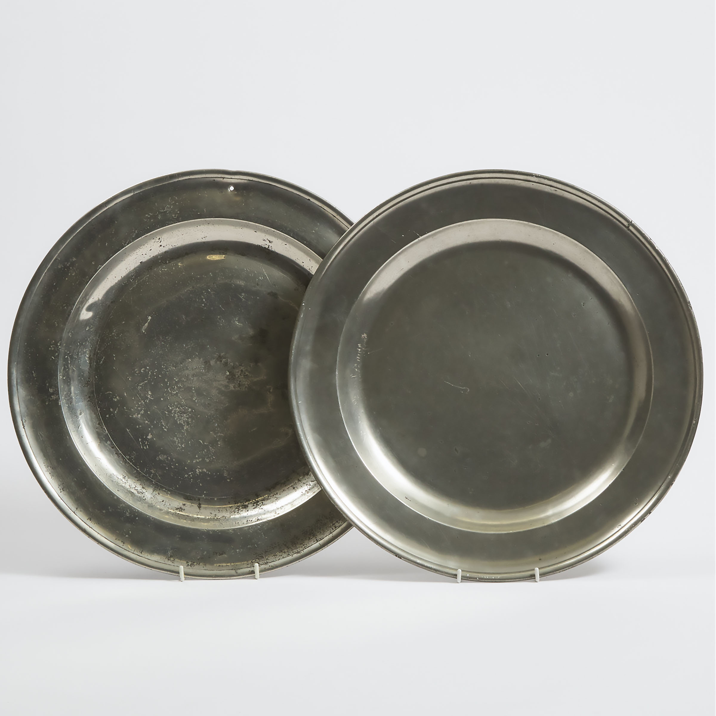 Two English Pewter Single Reed Chargers, early 18th century