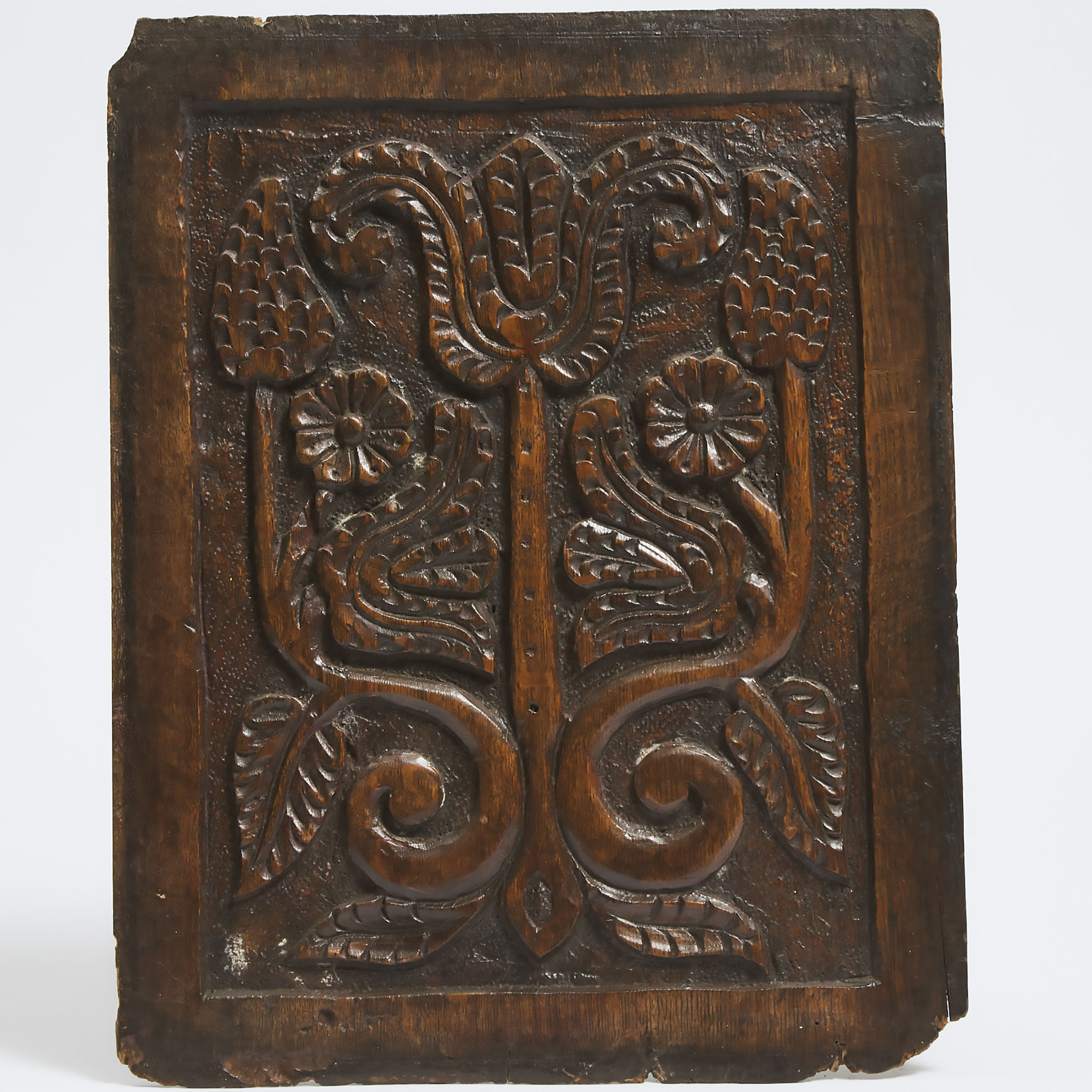 English Relief Carved Oak Panel with a Tulip and Roses, 17th century