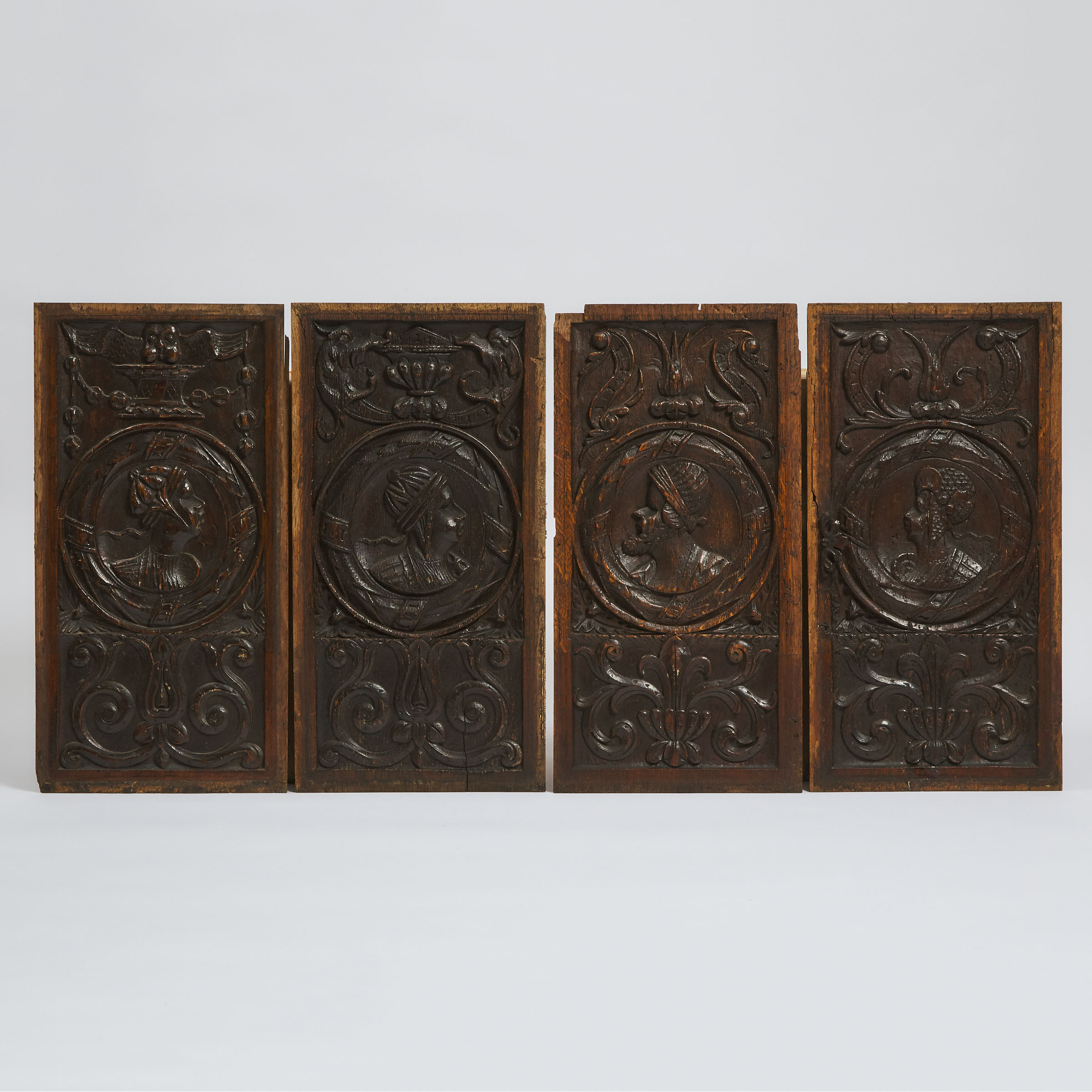 Matched Set of Four English Relief Carved Oak Romayne Panels, 16th century and later