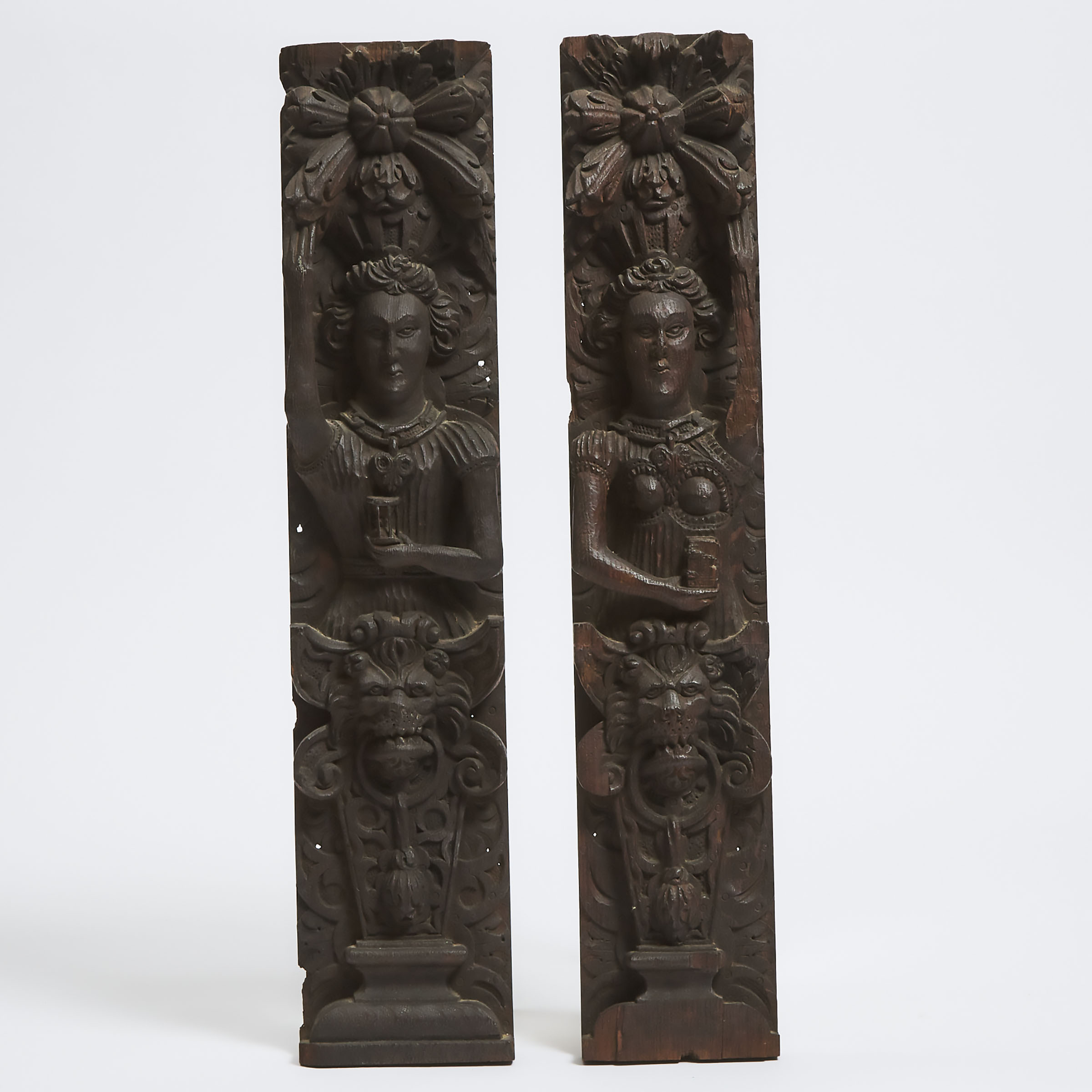 Pair of Tudor Carved Oak Figural Terms, 16th/early 17th century