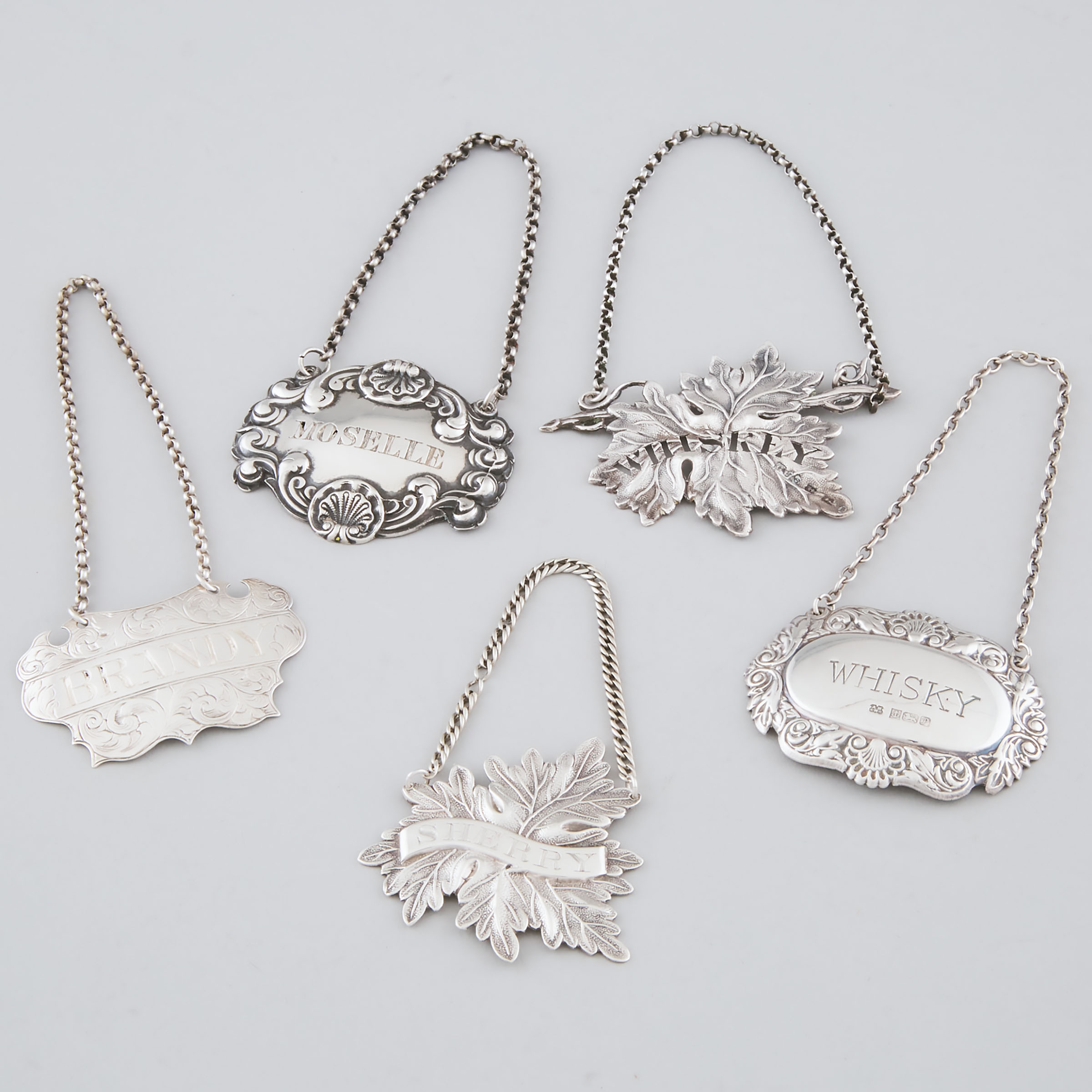 Five Victorian and Later English Silver Wine Labels, Birmingham and Edinburgh, 19th/20th century