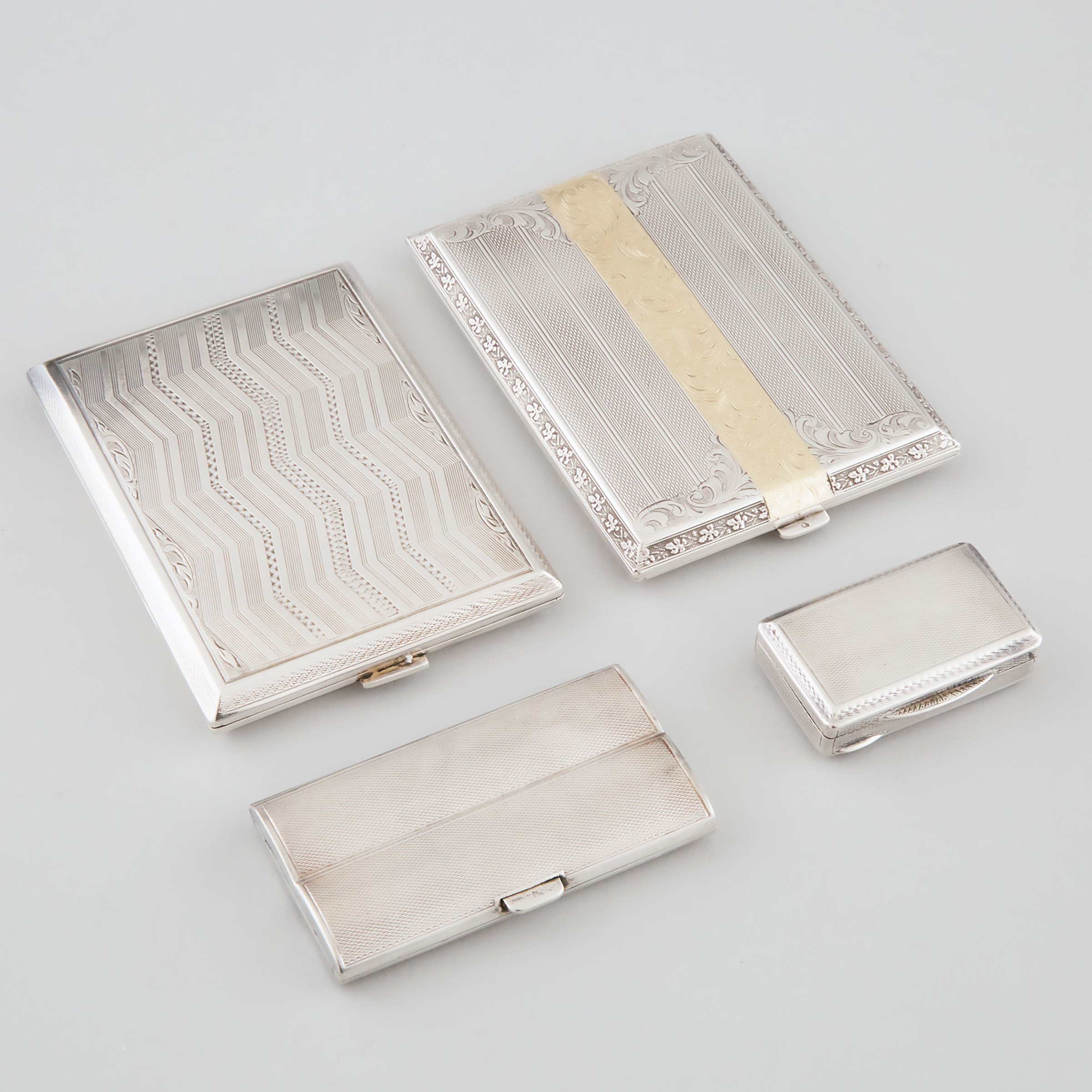 Three Austrian Silver Cigarette Cases and a Snuff Box, 20th century
