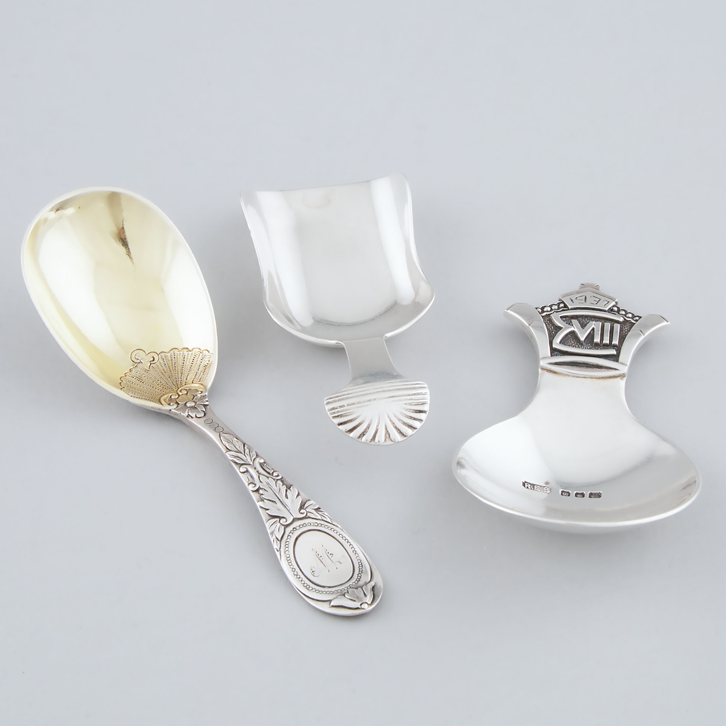 Three Victorian and Later English Silver Caddy Spoons, London and Birmingham, 1877/1904/1937