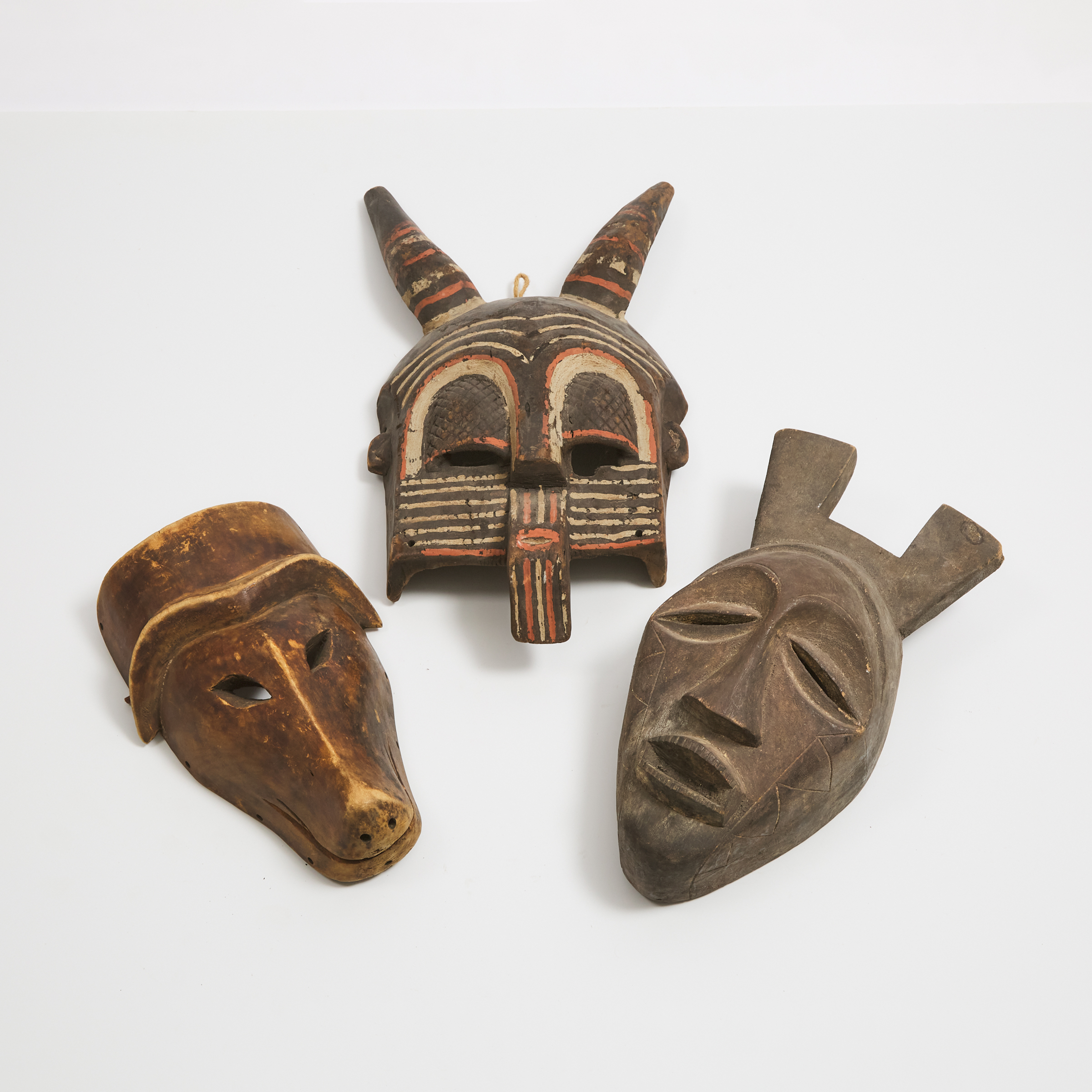 Group of Three Unidentified African Masks, 20th century