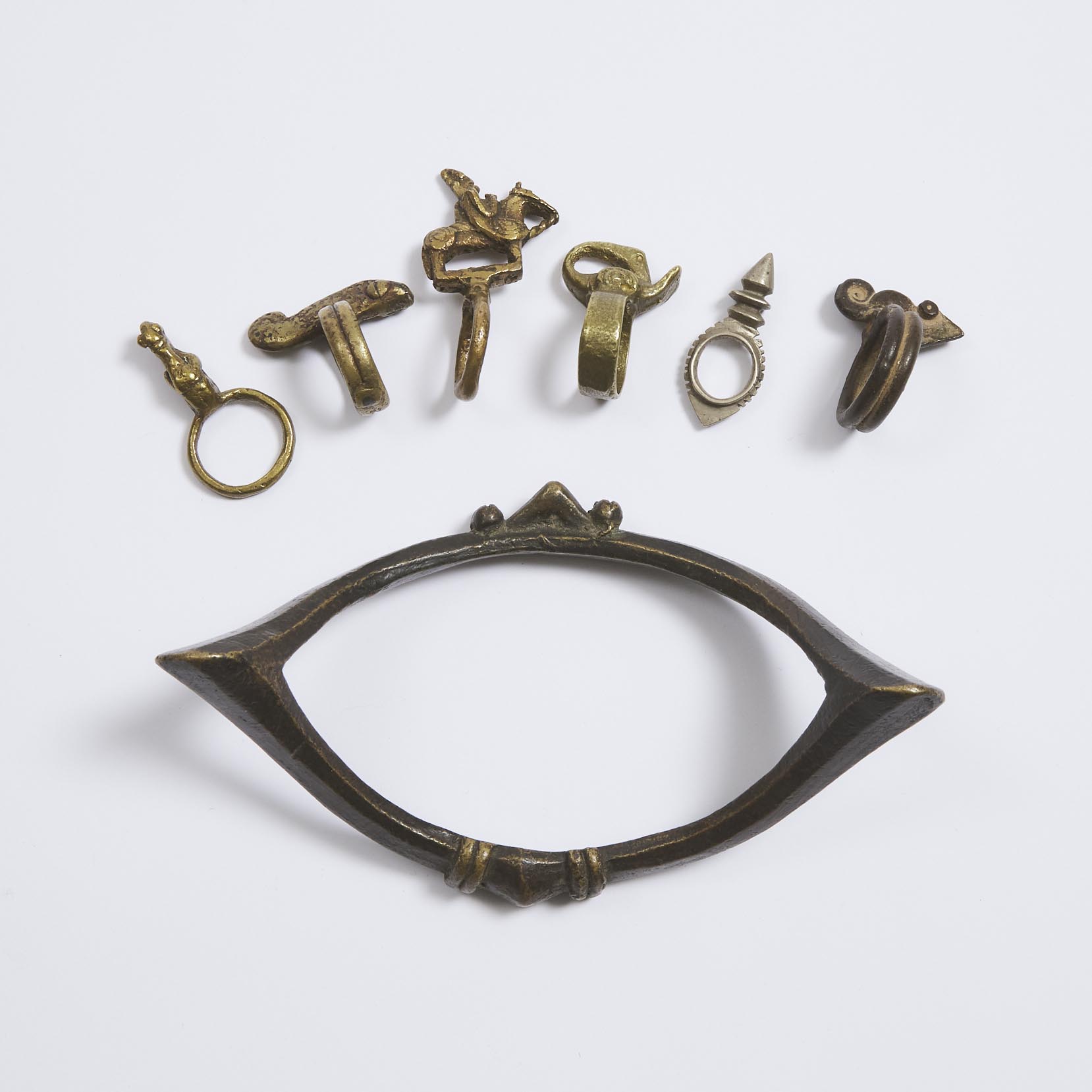 Senufo Bronze Manilla (Currency) Anklet, South Africa together with Six Rings